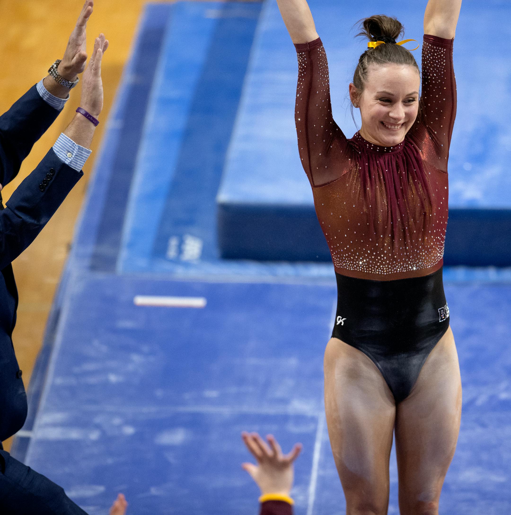 Lexy Ramler of Minnesota reacts after competing in the uneven bars.
