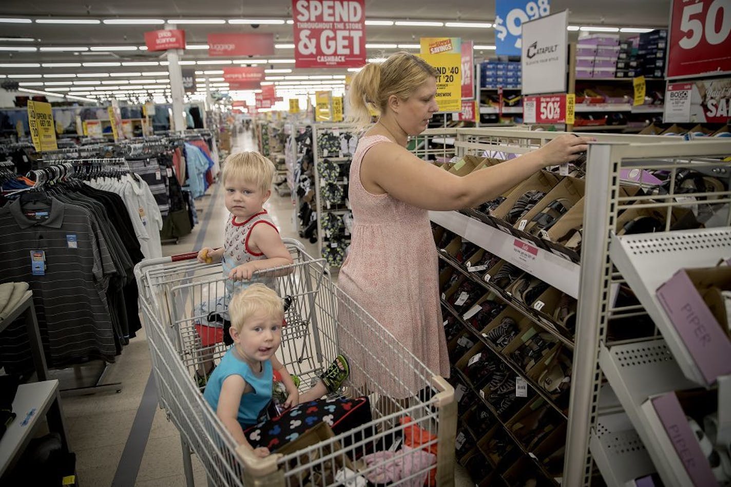 Alexa Peterson said she drives from Eagan to the Lake Street Kmart since the one in the South Metro and St. Paul closed. Peterson, who was shopping with her boys Skye, 1, center, and Leo, 3, said she loves their reward program and the sales are worth the trip, Friday, June 1, 2018 in Minneapolis, MN.