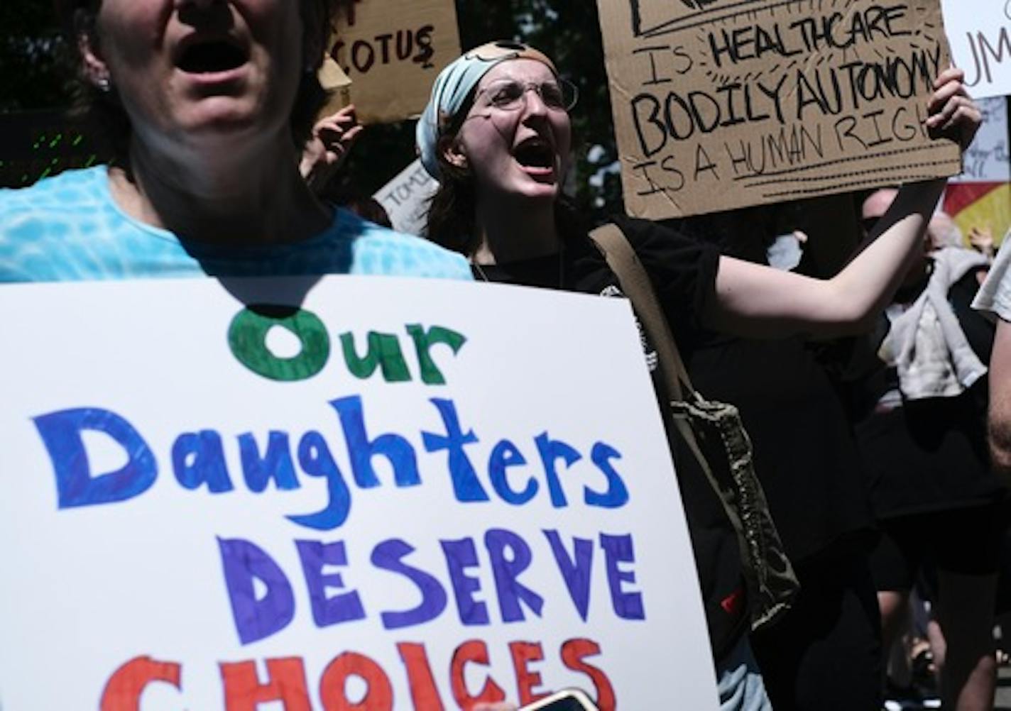 Abortion rights demonstrators gather outside of the Supreme Court the day after the court overturned Roe v. Wade, effectively outlawing abortion in many states, in Washington, June 25, 2022. Around the country, a patchwork of laws took hold amid protest and celebration. (T.J. Kirkpatrick/The New York Times)