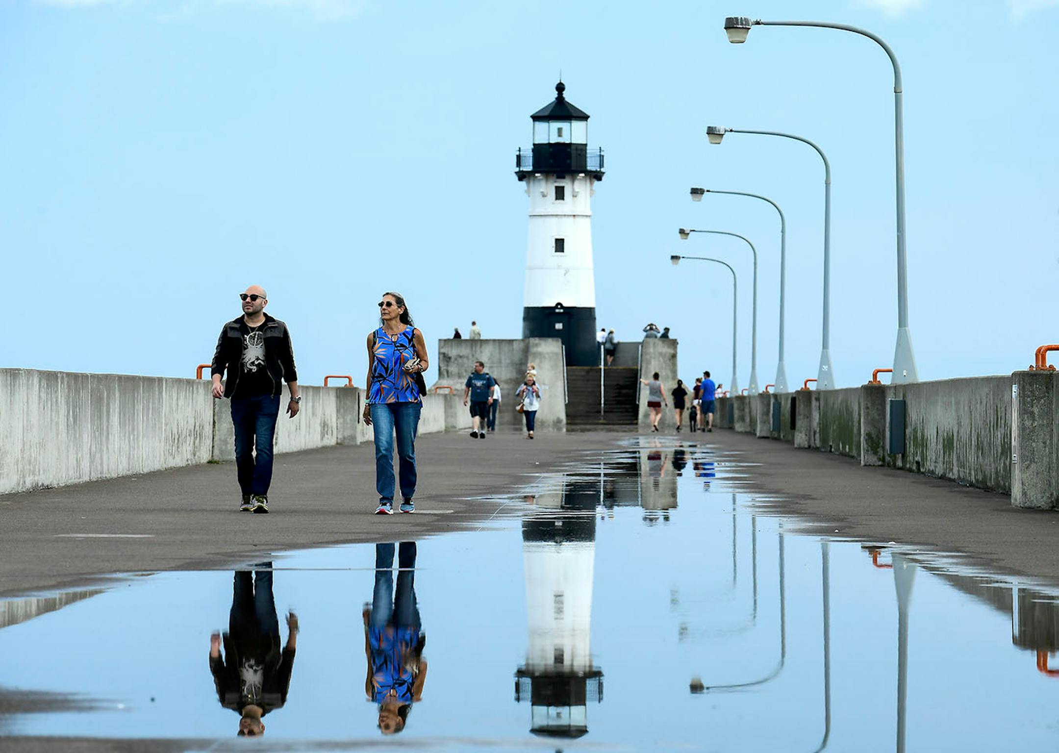 Leo Perez, a post-doctoral student living in Minneapolis, and his mother, Amara, visiting from Puerto Rico, walked along Canal Park's North Pier Wednesday afternoon.