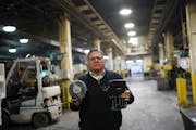 Twin City Die Castings CEO Todd Olson held two of his companies products, a fan assembly and a casting for oxygen generator.