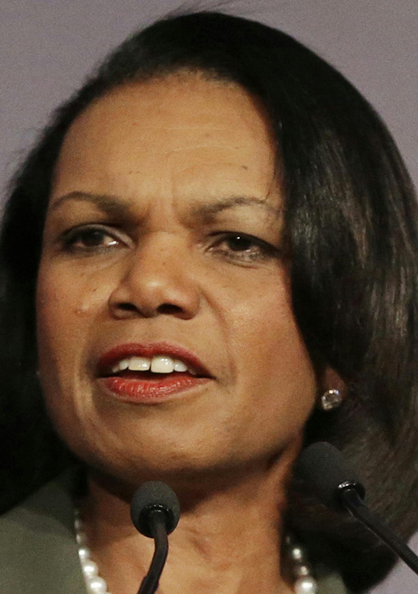 FILE - In this March 15, 2014 file photo, former Secretary of State Condoleezza Rice gestures while speaking at the California Republican Party 2014 Spring Convention in Burlingame, Calif. University of Minnesota faculty and student activists are pressuring the school to rescind its invitation to Rice to speak at the Twin Cities campus April 17 as part of the Humphrey School of Public Affairs&#x201a;&#xc4;&#xf4; lecture series. Math professor William Messing has introduced a resolution to be con