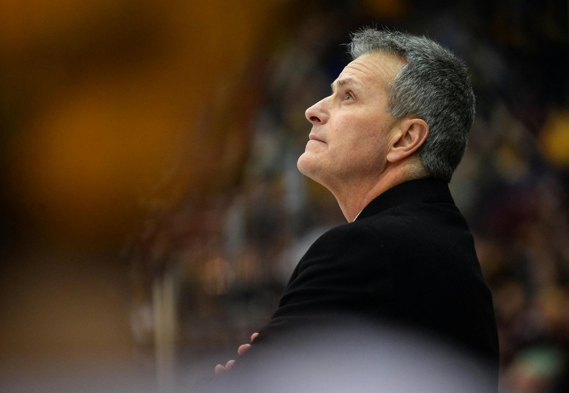 Minnesota Golden Gophers head coach Don Lucia watched a replay during a break in the action in the third period Friday night against the Penn State Nittany Lions.