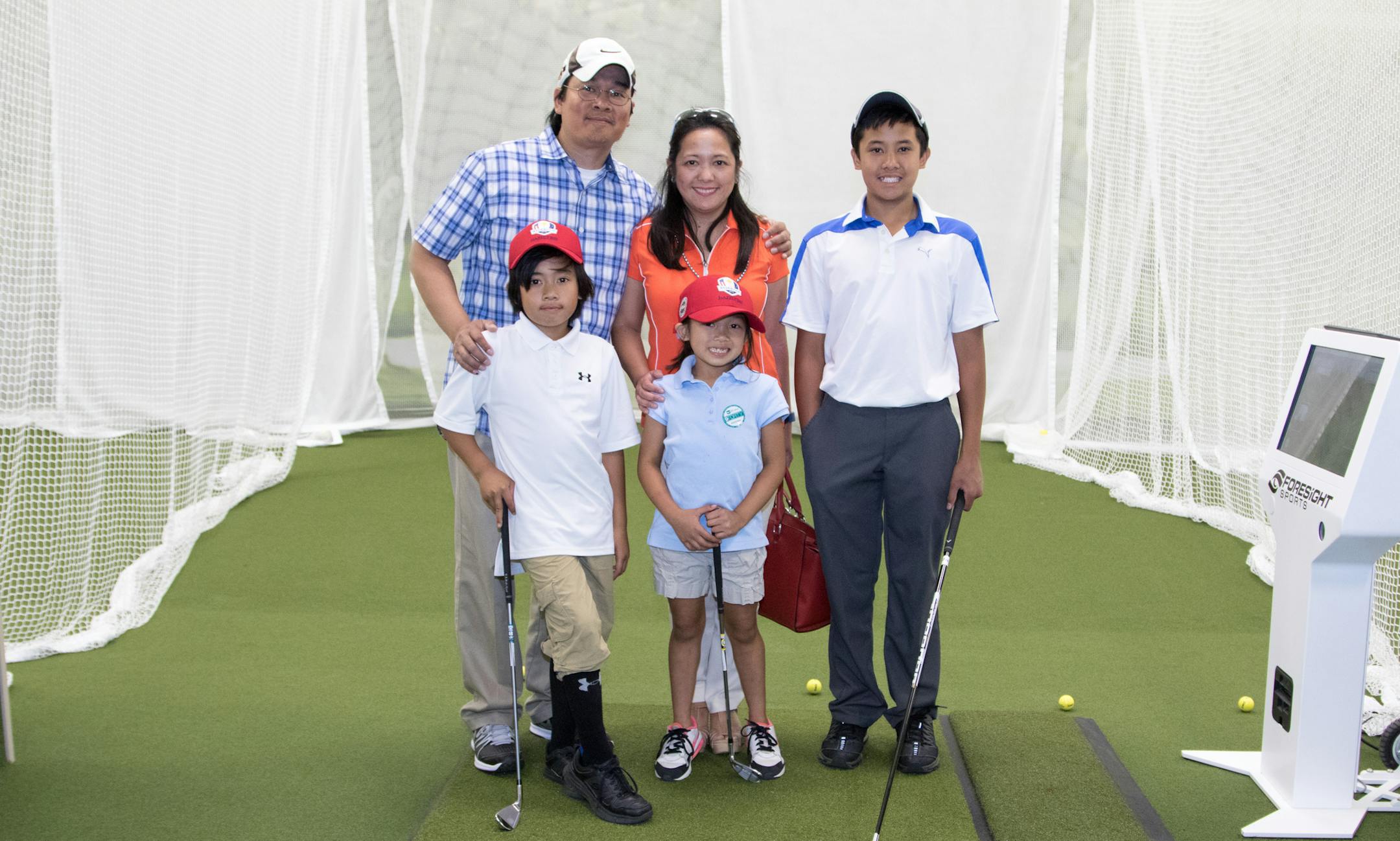 The Labradors, Rick, Sharon, Christian (back row), Michael (front left) and Abigail try out the in-store greens at the ribbon cutting ceremony of the PGA Tour Superstore on June 9, 2016 at the PGA Tour Superstore in Minnetonka, Minn. ] Special to Star Tribune, Matt Blewett | matt@mattebphoto.com, Matte B Photography, PGA Tour Superstore, FACE062816 Saxo 846516