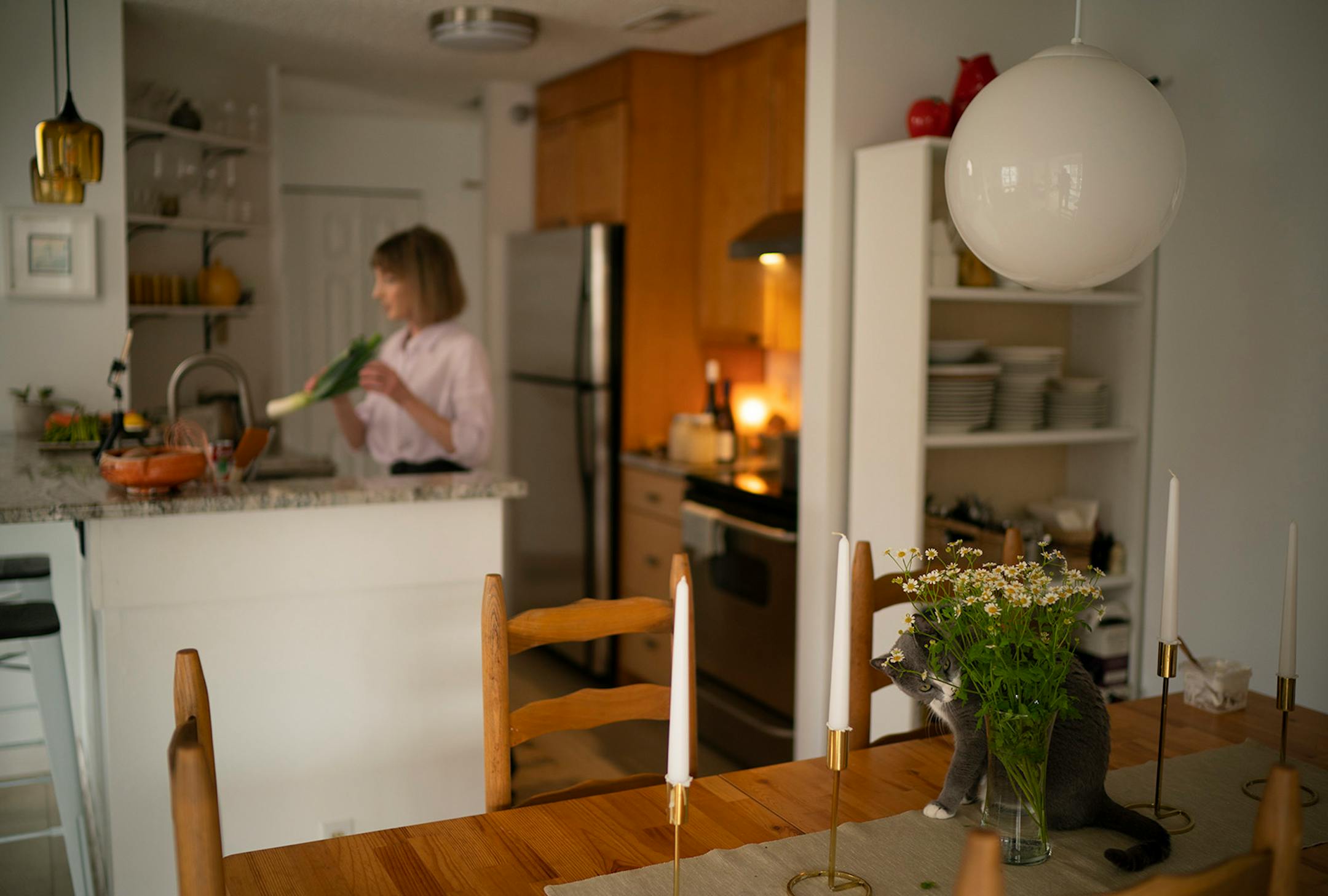 While chef Karyn Tomlinson was filming her Instagram cooking show, her cat, Ellie, was munching on flowers on her dining room table. Since the pandemic began, former Corner Table chef Karyn Tomlinson has been a prolific poster to Instagram, offering free cooking lessons with her show "Karyn's Quarantine Kitchen." She was photographed producing a segment on preparing pureed soups Thursday afternoon, April 23, 2020 in the kitchen of her condo.