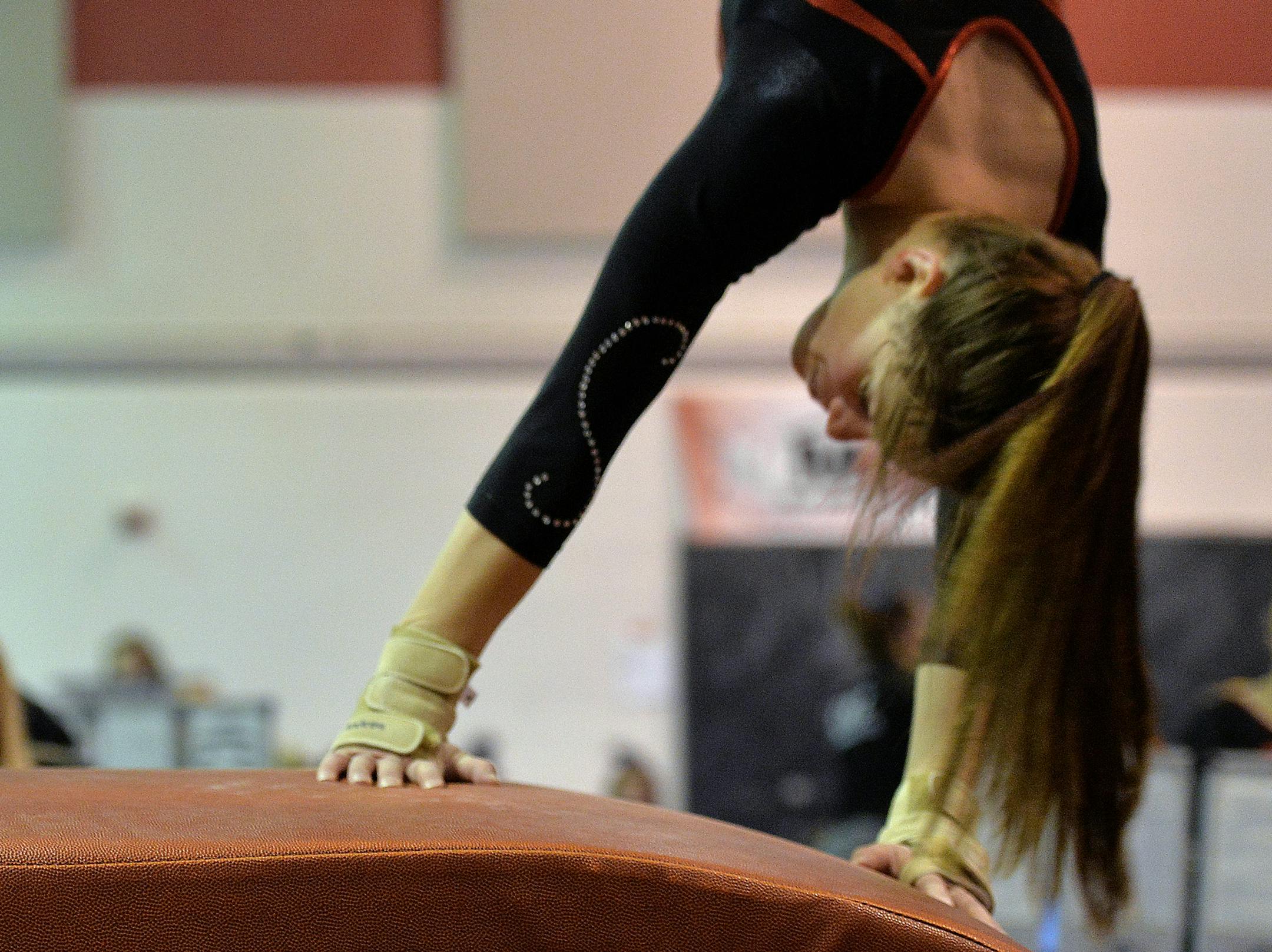 Centennial junior, Andrea Gessner performs on the vault during a recent meet against Elk River High School. ] (SPECIAL TO THE STAR TRIBUNE/BRE McGEE) **Andrea Gessner (gymnast, junior)