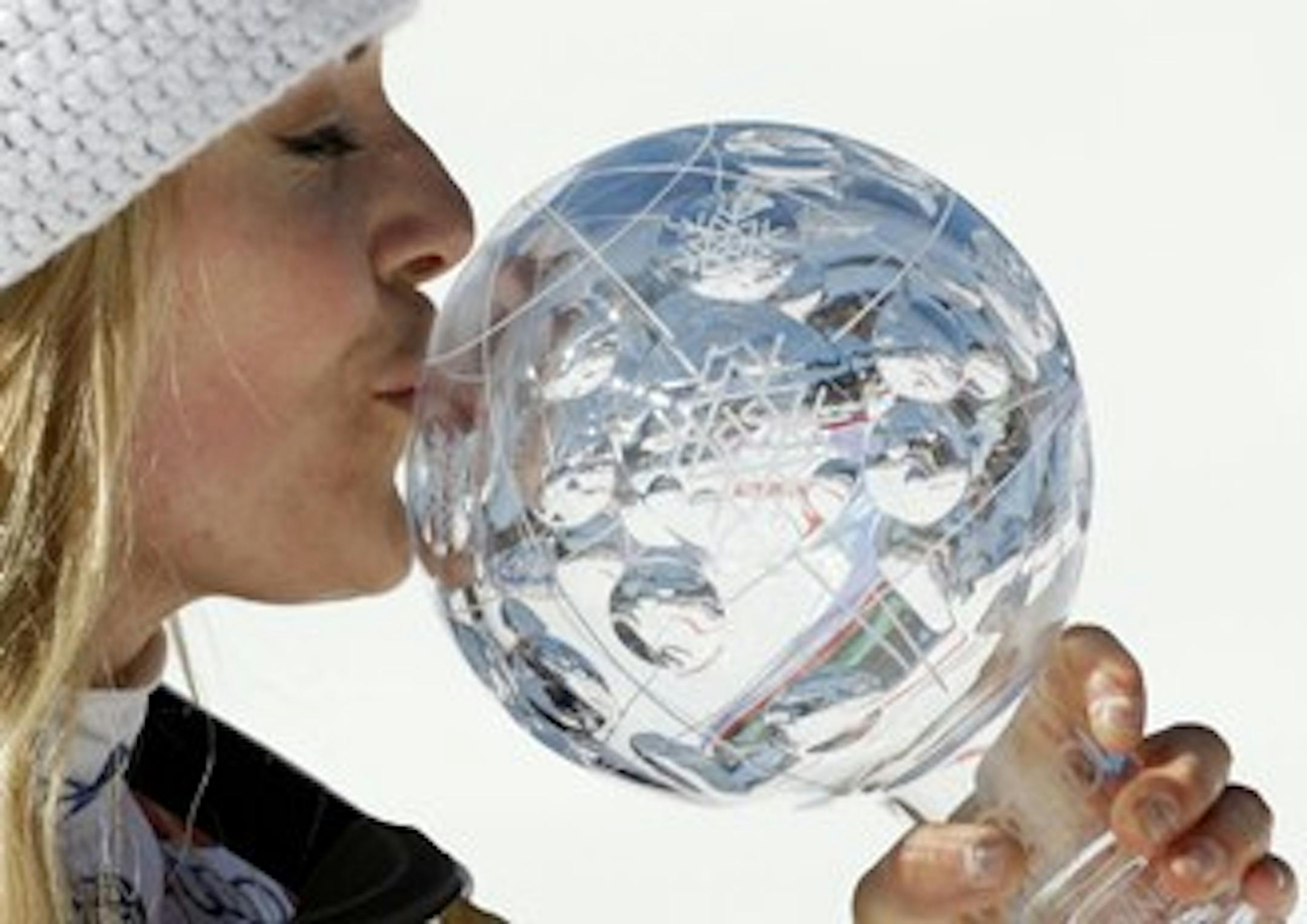 Lindsey Vonn, pretending that orb is Tiger Woods' head?