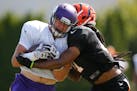 Minnesota Vikings tight end Brian Leonhardt (87) makes a catch as Cincinnati Bengals defensive back Floyd Raven (41) defends during joint practice bet