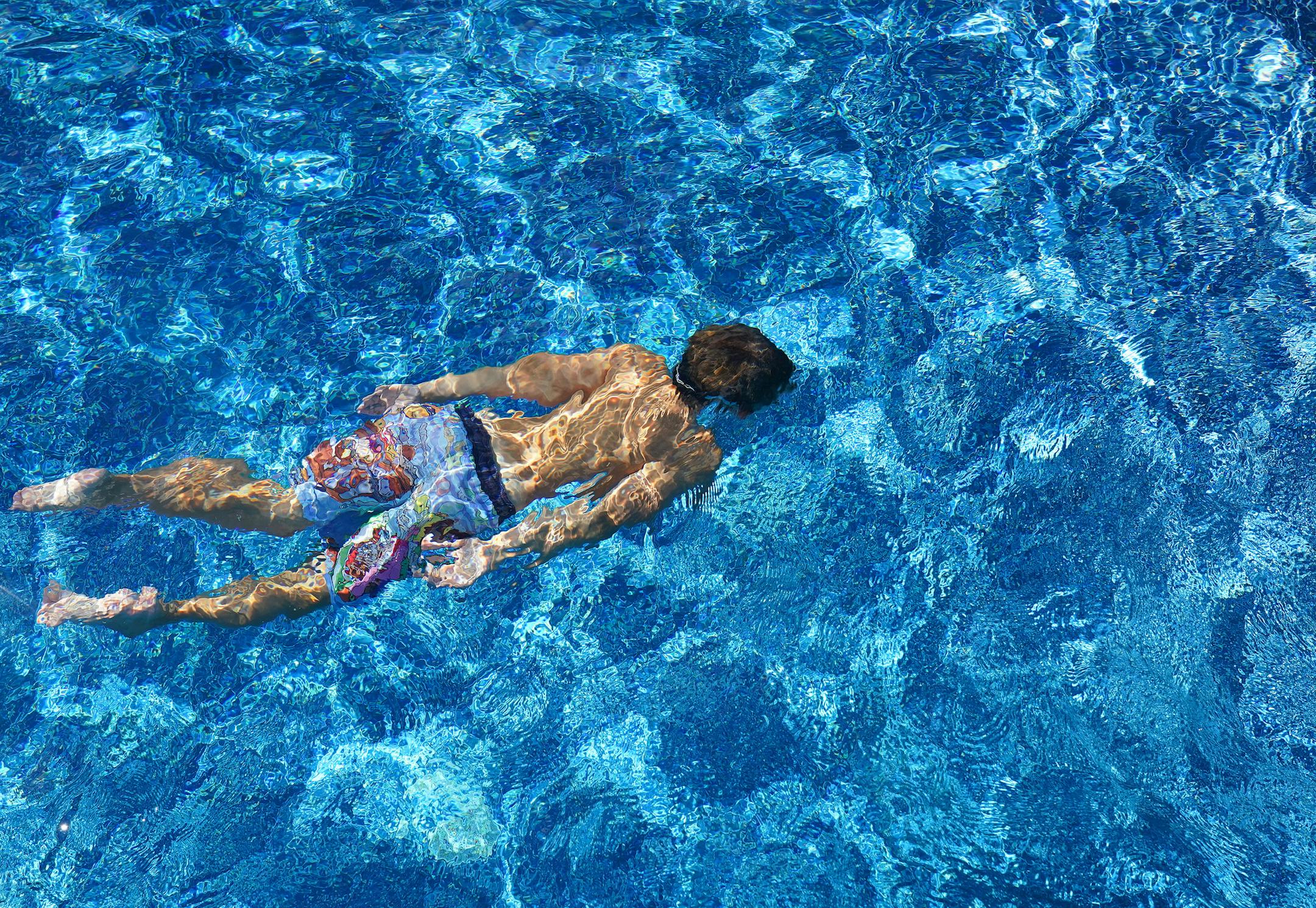 Jack Meyer, 9, swam underwater in his aunt and uncle's newly installed in-ground pool Tuesday. ] ANTHONY SOUFFLE • anthony.souffle@startribune.com The Lemcke family swam in their newly installed in-ground pool together Tuesday, Aug. 4, 2020 at their home in Ramsey, Minn.