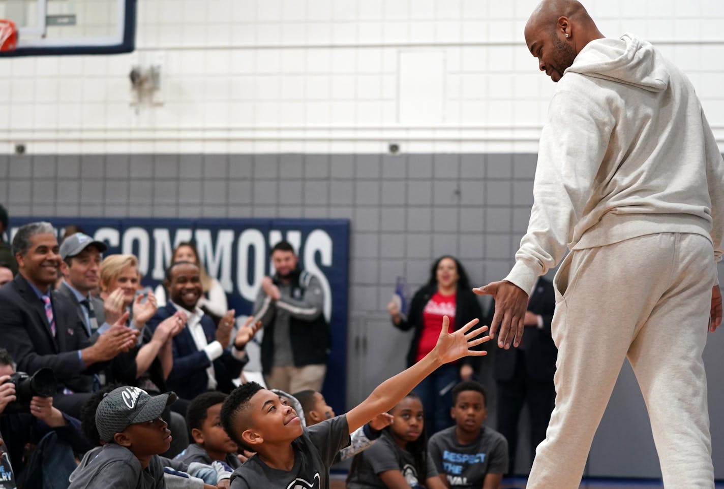 Former NCAA and NBA basketball player Devean George greeted students after speaking during a dedication for the finished Final Four "Legacy Project" basketball court at the North Commons Recreation Center. ] ANTHONY SOUFFLE &#x2022; anthony.souffle@startribune.com The NCAA local organizing committee held a press conference to unveil the finished Final Four "Legacy Project" basketball court Tuesday, April 2, 2019 at North Commons Park Recreation Center in north Minneapolis.