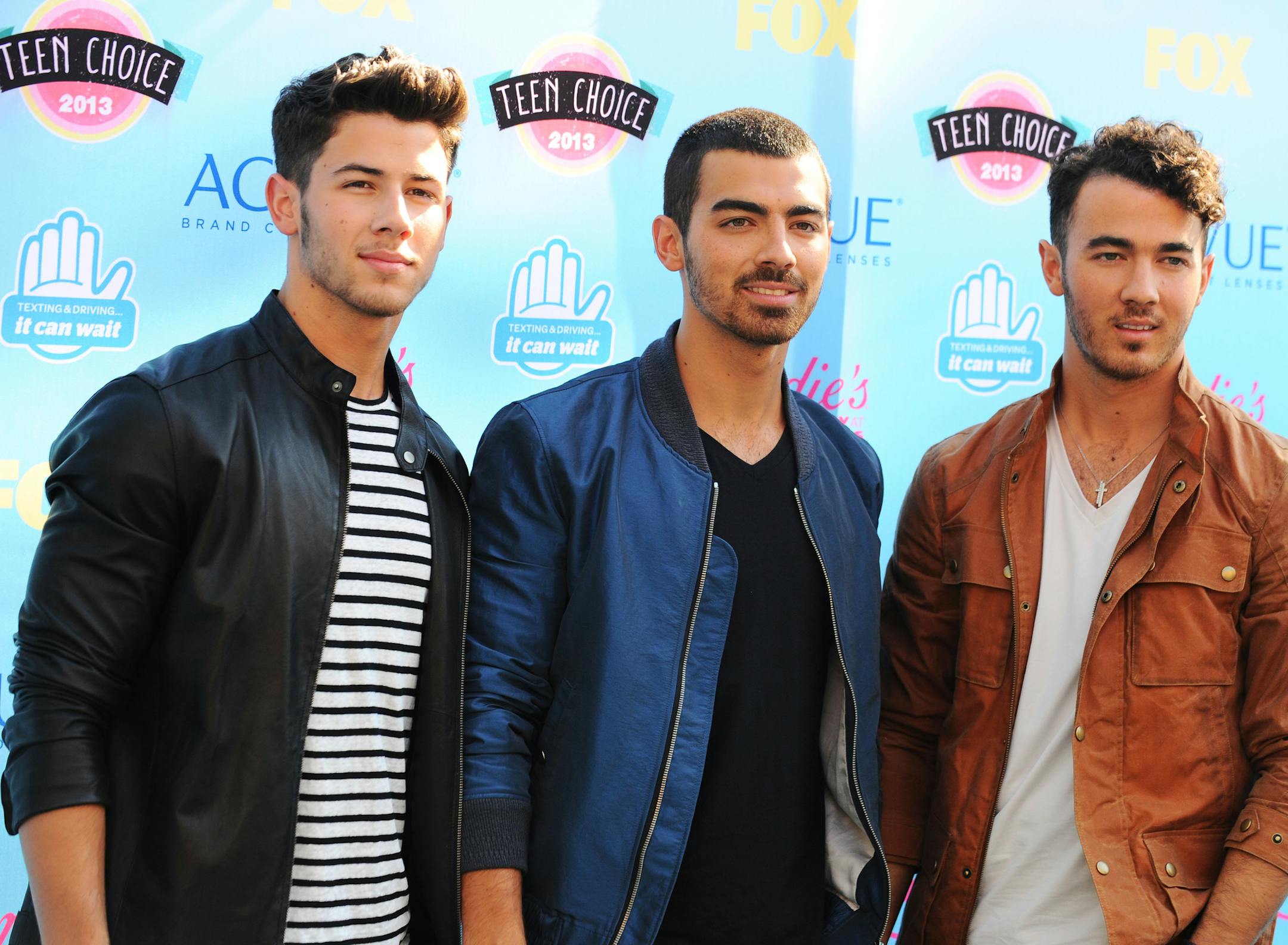FILE - In this Aug. 11, 2013 file photo, from left, Nick Jonas, Joe Jonas and Kevin Jonas of the musical group Jonas Brothers arrive at the Teen Choice Awards at the Gibson Amphitheater, in Los Angeles.