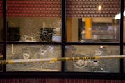 Bullet holes in the windows of the Clientele Barber Shop. ] JEFF WHEELER • jeff.wheeler@startribune.com