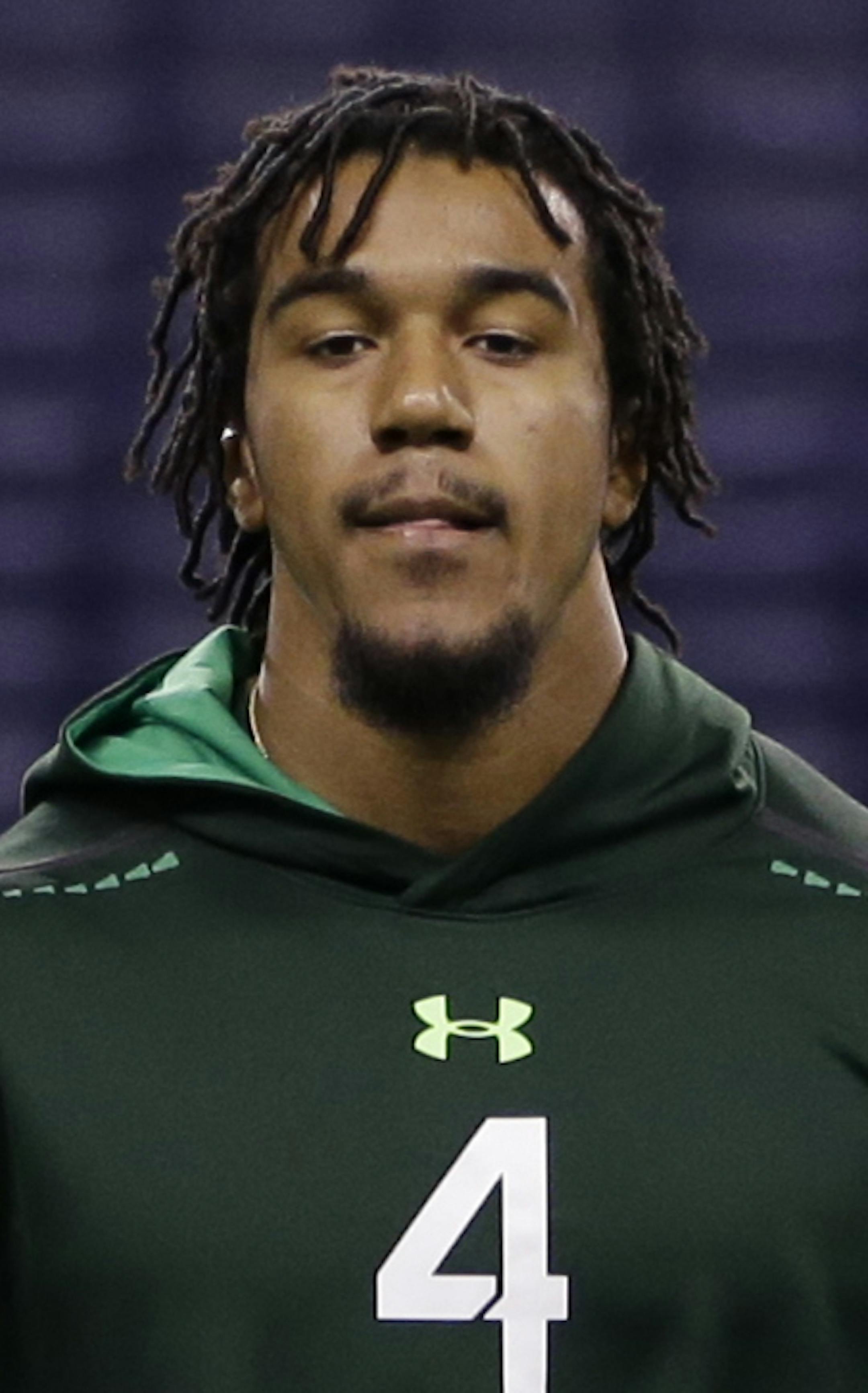 Clemson defensive lineman Vic Beasley stretches before drills at the NFL football scouting combine in Indianapolis, Sunday, Feb. 22, 2015. (AP Photo/Julio Cortez) ORG XMIT: INJC10