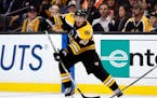 The Bruins' Brad Marchand looked to pass the puck against the Vegas Golden Knights during the second period in Boston on Thursday.