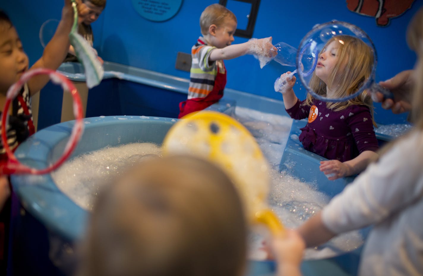 Emily Garden, at right, of Roberts, Wis., blew bubbles at the Children's Museum in St. Paul, Minn., on Friday, April 12, 2013. ] (RENEE JONES SCHNEIDER * reneejones@startribune.com)