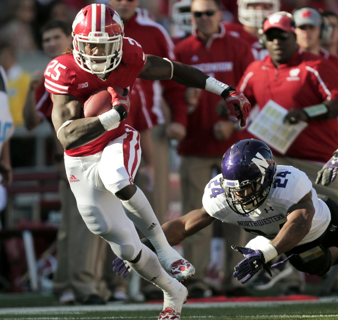 Wisconsin running back Melvin Gordon runs for a first yard against Northwestern safety Ibraheim Campbell during the first half of an NCAA college football game in Madison, Wis., Saturday, Oct. 12, 2013. Wisconsin upset Northwestern 35-6. Gordon had 176 yards. (AP Photo/Andy Manis) ORG XMIT: WIAM108