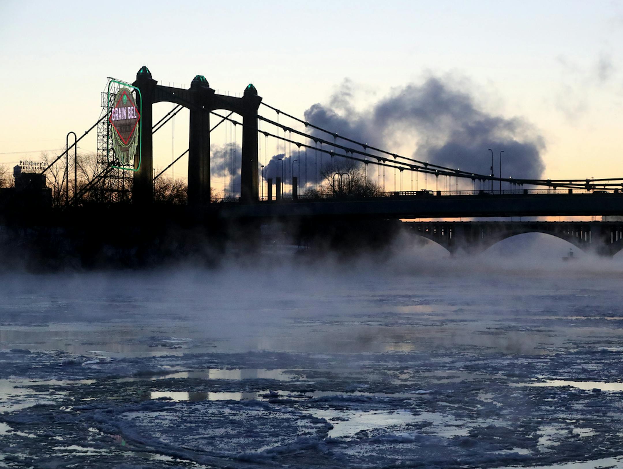 Water vapor rises Thursday morning from the Mississippi River near the Hennepin Ave. Bridge in Minneapolis, as seen from West River Pkwy.