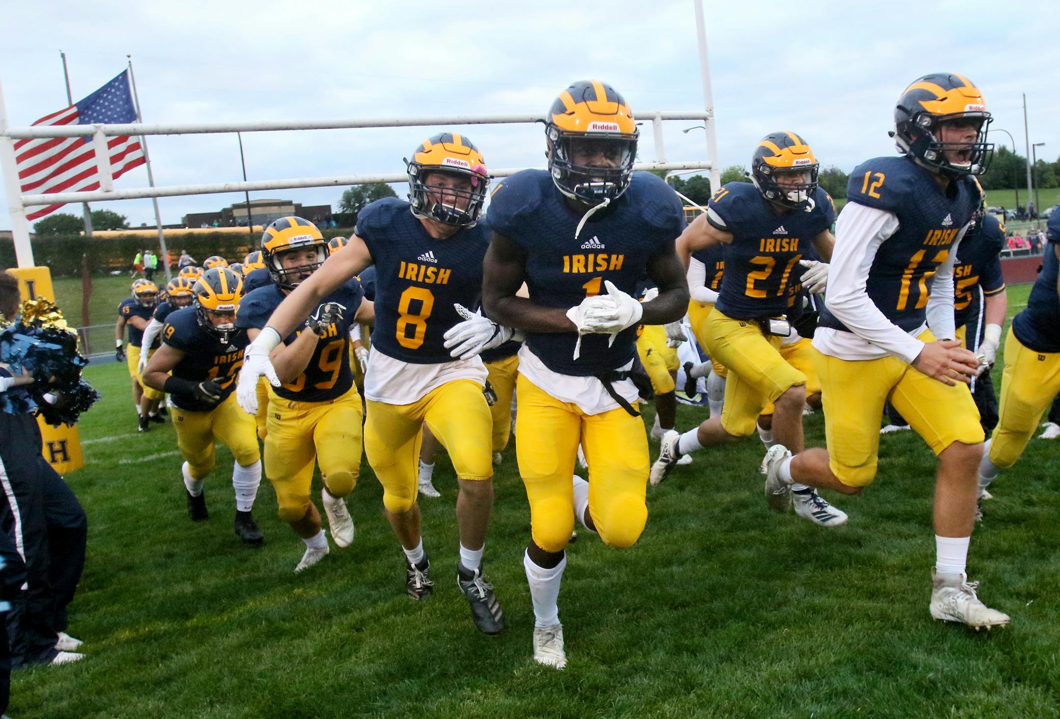 Rosemount High receiver Jonathan Mann (1), who is also a Gopher recruit, heads onto the field with teammates to take on Lakeville North Friday, Sept. 13, 2019, at Rosemount High in Rosemount, MN. Lakeville North beat Rosemount 20-3.] DAVID JOLES • david.joles@startribune.com Lakeville North at Rosemount in prep football game action