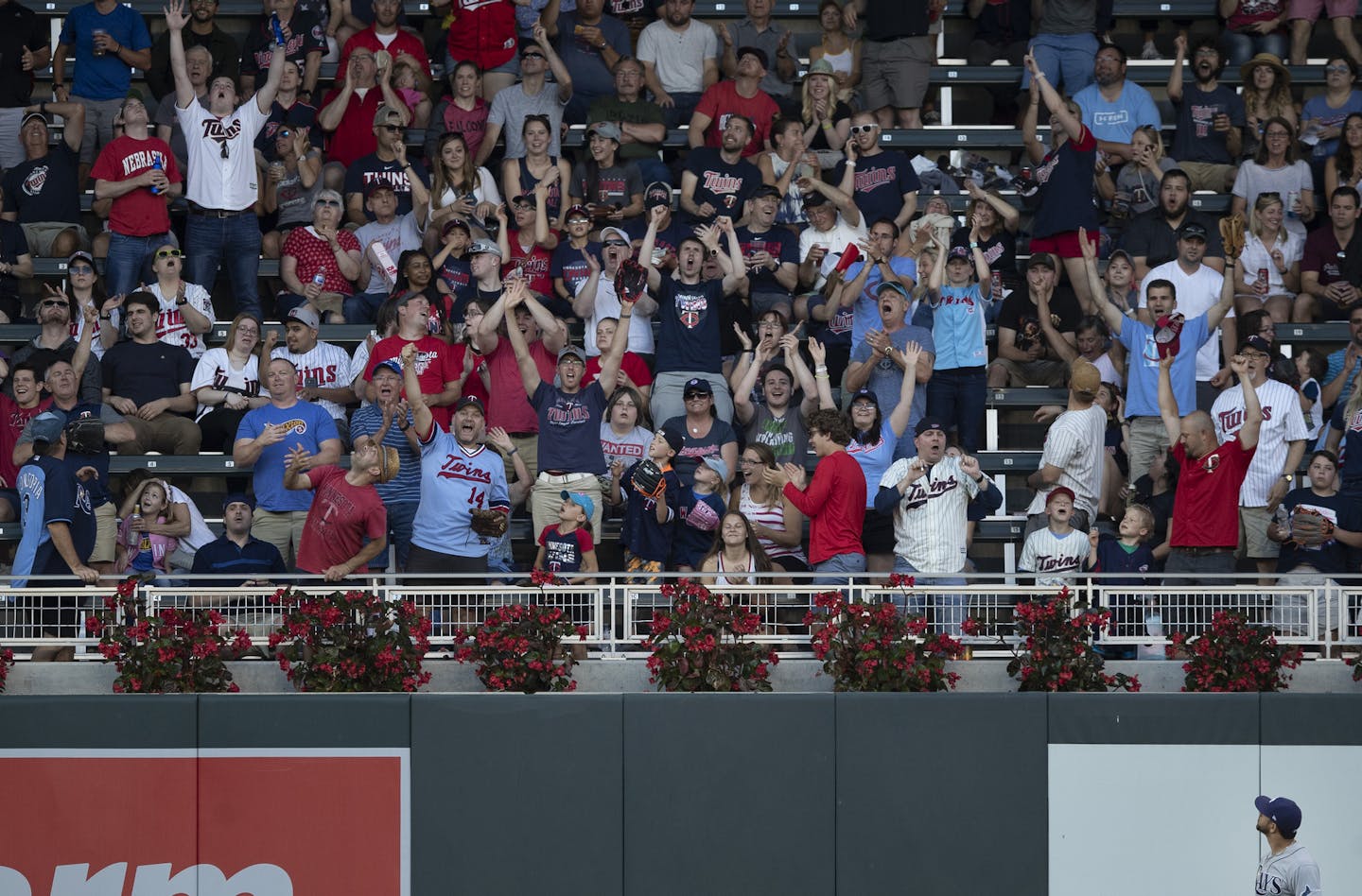 Rays left fielder Tommy Pham looked up at a home run hit by the Twins' Jonathan Schoop in the third inning at Target Field on Tuesday.