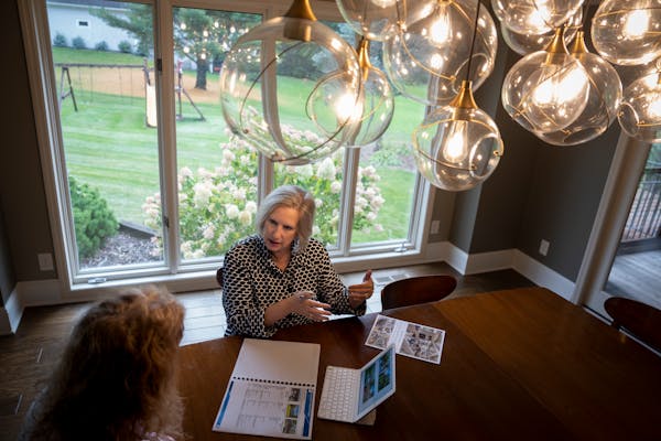 Twin Cities real estate agent Krista Wolter met earlier this month with a prospective seller in North Oaks to discuss the market for home sales.