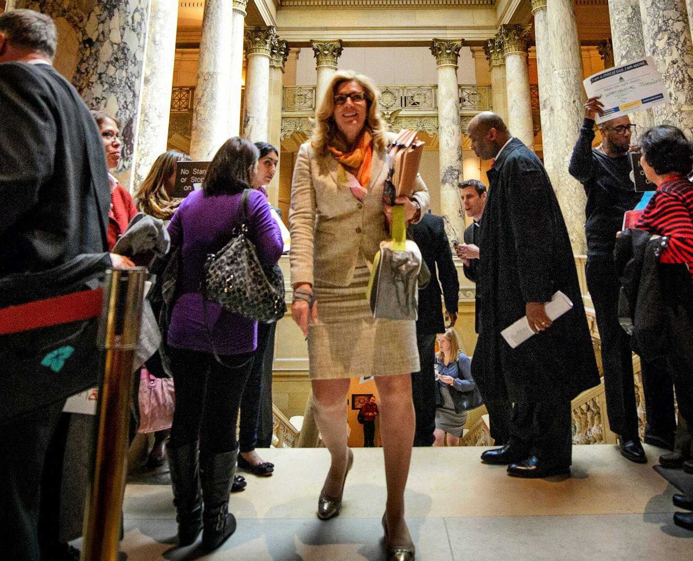 Senator Julie Rosen, R-Vernon Center, made her way past ISAIAH members gathered outside the Senate Chamber. ] GLEN STUBBE * gstubbe@startribune.com Thursday, April 23, 2015 Drivers license legislation has been added to the Senate Transportation Omnibus Bill. Prior to the vote, members of ISAIAH visited with legislators and held a faith rally and prayer vigil outside of the Senate chamber in the State Capitol.