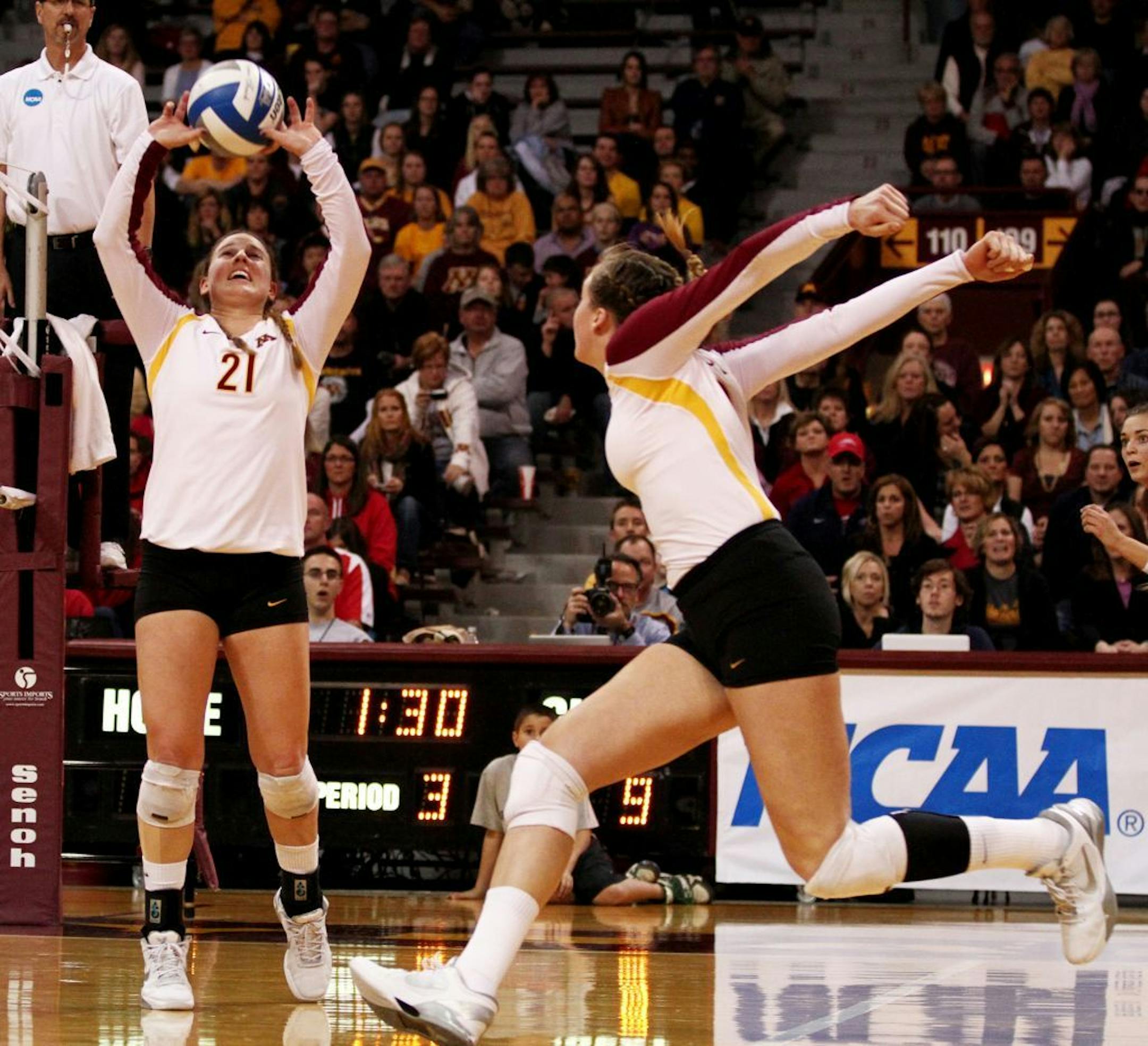 Minnesota's Alexandra Palmer set the ball up for a spike.
