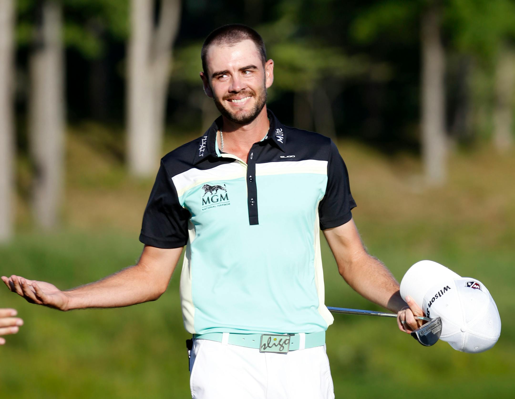 Troy Merritt celebrated winning the Quicken Loans National golf tournament at the Robert Trent Jones Golf Club in Gainesville, Va., on Sunday. Merritt finished the four rounds at 18 under par.