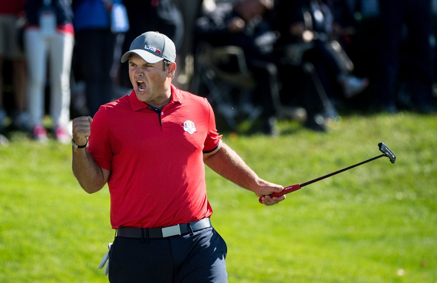 USA's Patrick Reed celebrates a match-winning birdie on the 16th hole during Friday morning's Ryder Cup foursomes competition at Hazeltine.