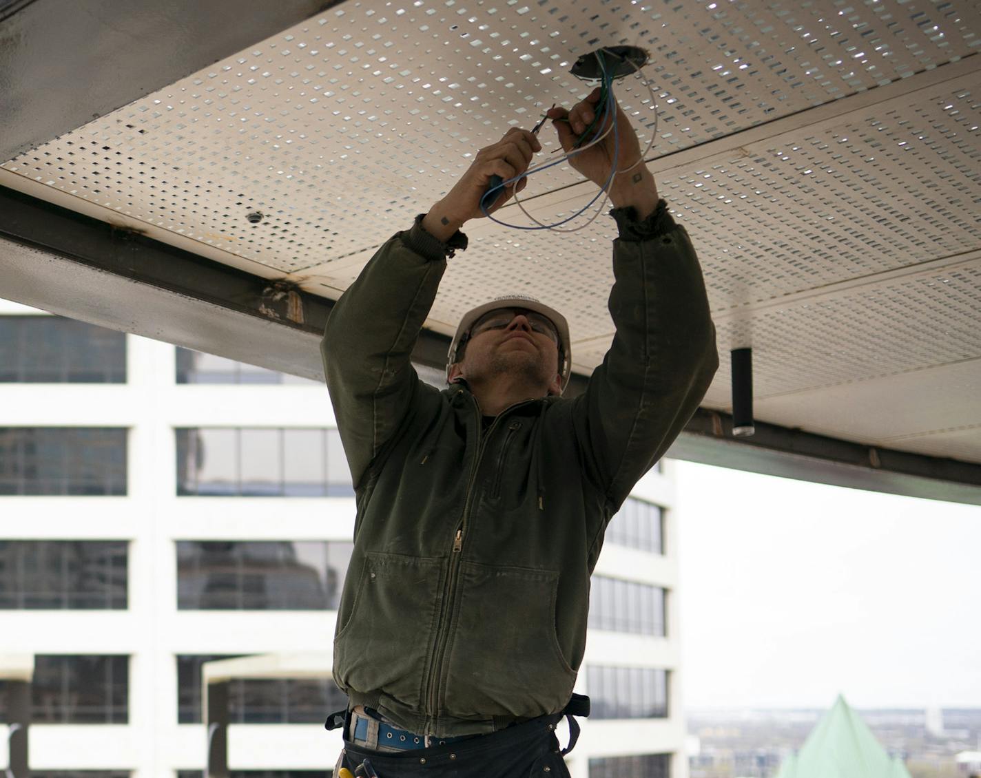 Construction workers worked on the 15th floor rooftop deck at the Capella Tower Wednesday. ] JEFF WHEELER &#x2022; jeff.wheeler@startribune.com Some of the most iconic skyscrapers in downtown Minneapolis have recently been snatched up by deep-pocketed firms including several offshore conglomerates new to the Twin Cities office market. Shorenstein, new owner of the Capella Tower, is adding a rooftop deck for use by building tenants. Construction workers worked on the 15th floor rooftop deck at th