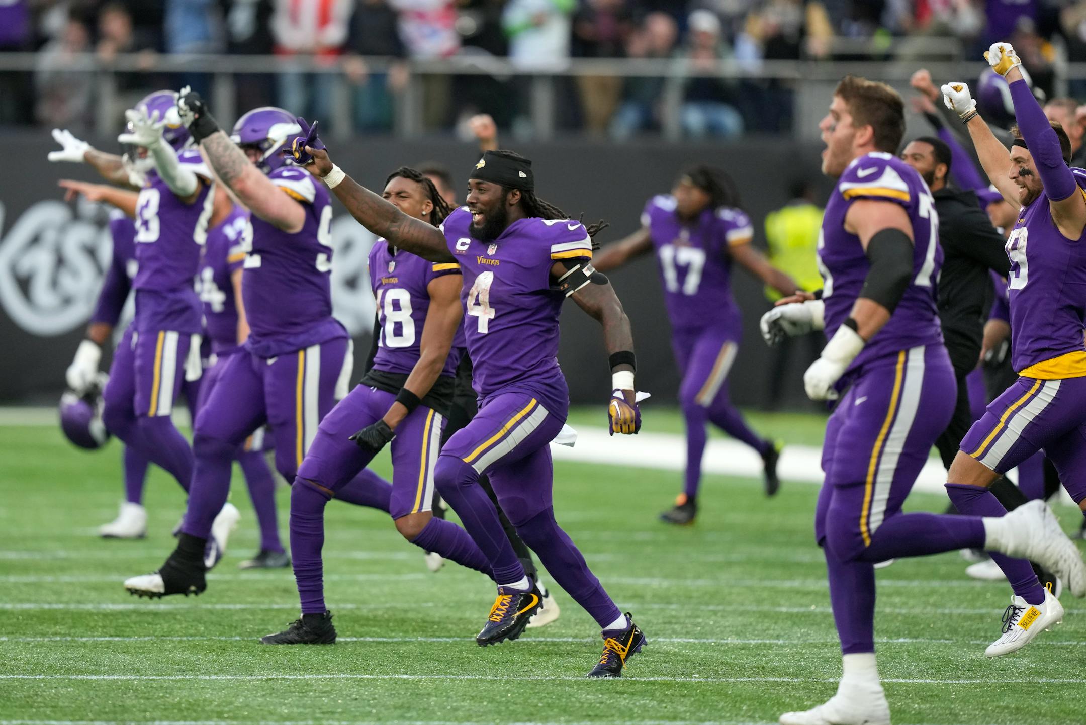 Minnesota Vikings players celebrate after beating the Saints.