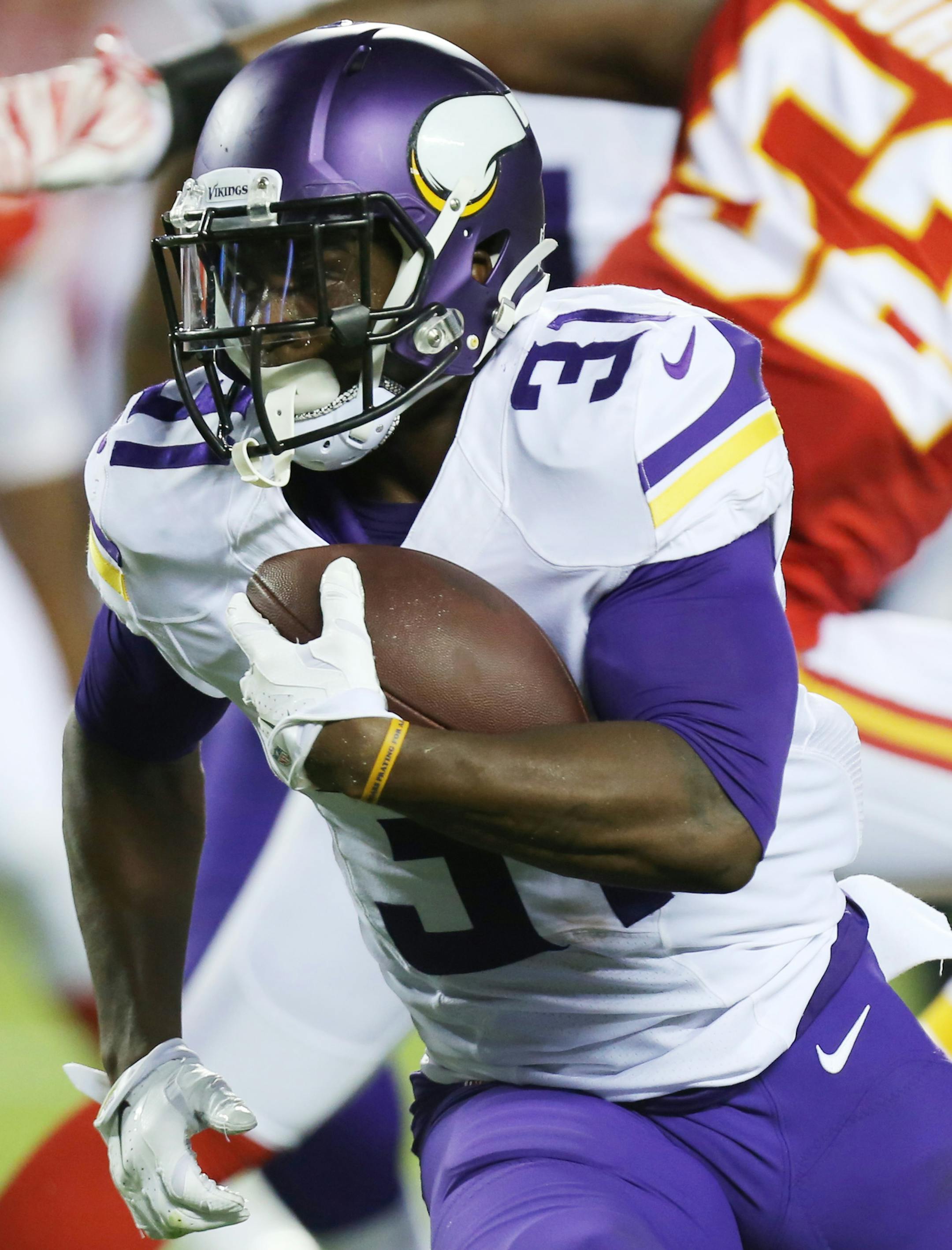 Minnesota Vikings running back Jerick McKinnon (31) carries the ball during the second half of an NFL preseason football game against the Kansas City Chiefs in Kansas City, Mo., Saturday, Aug. 23, 2014. (AP Photo/Ed Zurga) ORG XMIT: MONH136