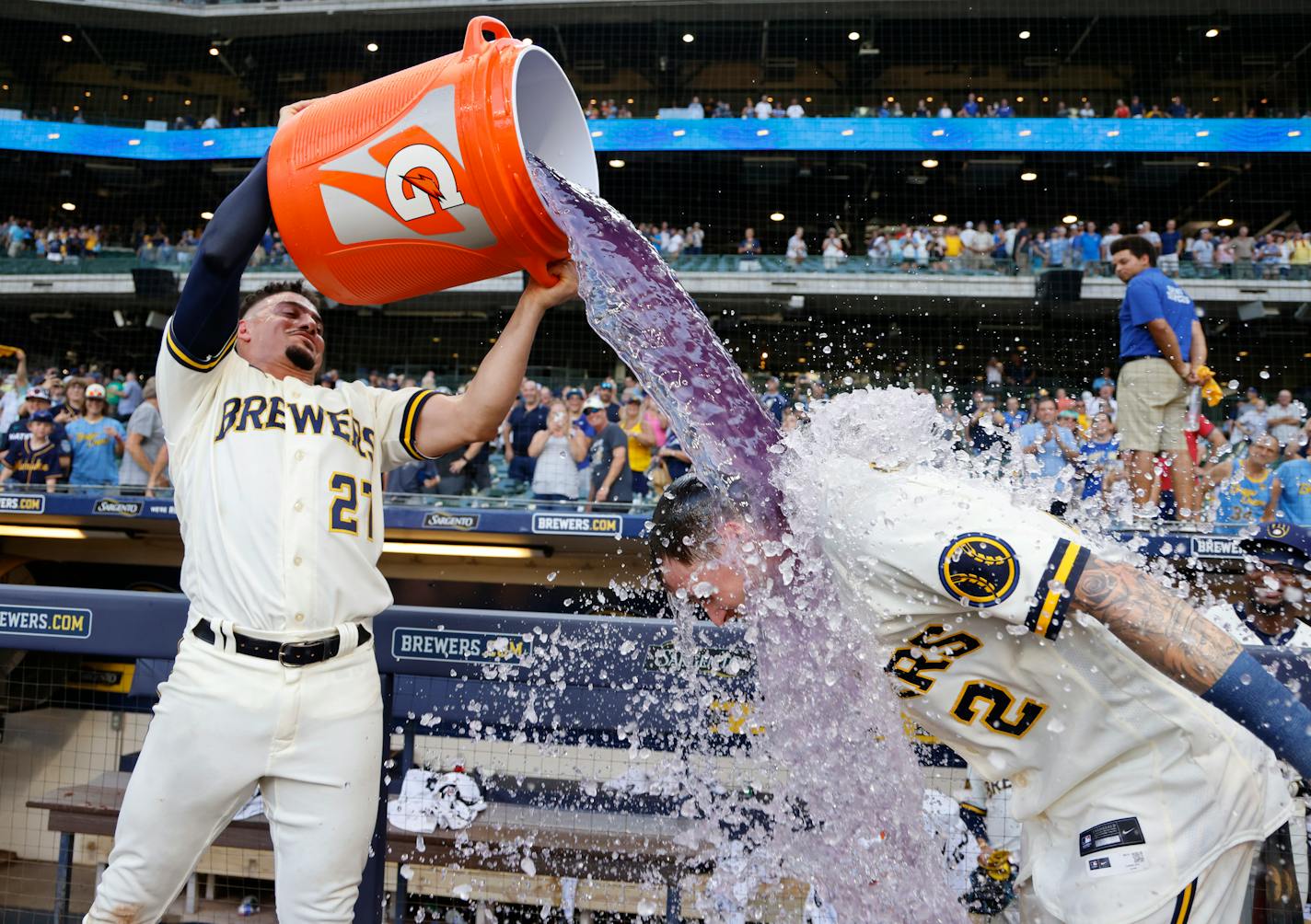 Milwaukee's Willy Adames doused Brice Turang with Gatorade after Turang hit a game-winning single against the Twins in the 10th inning.