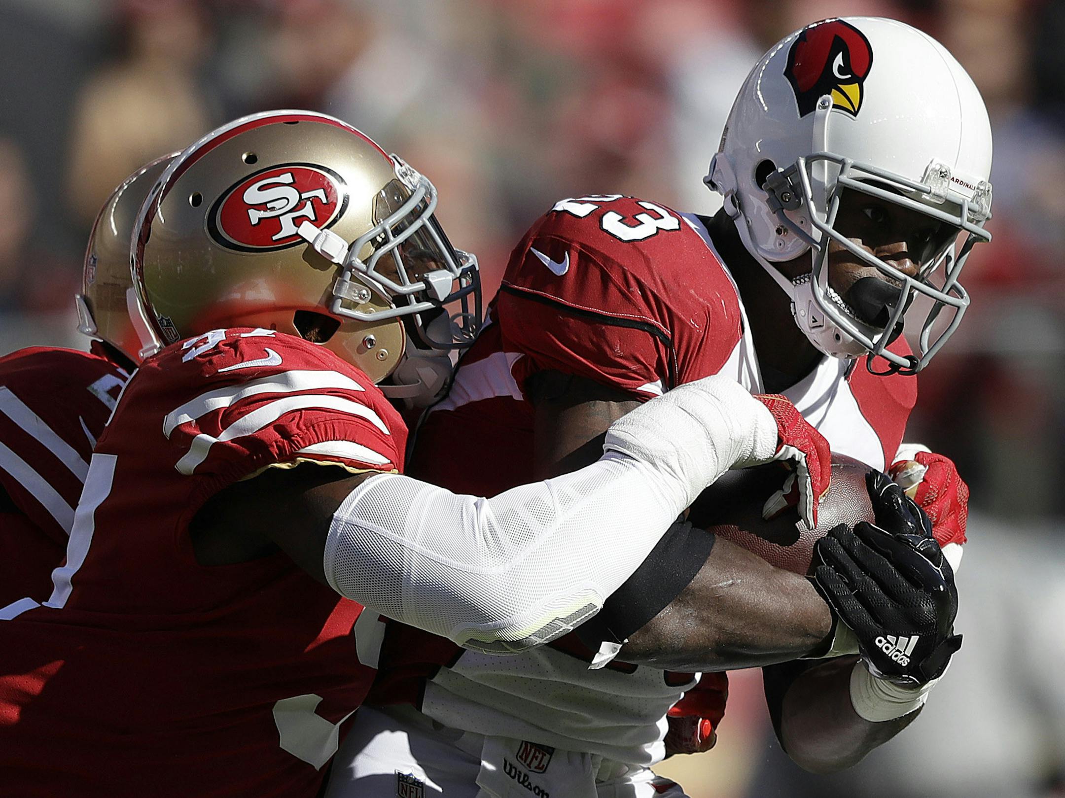 Arizona Cardinals running back Adrian Peterson, right, runs against San Francisco 49ers outside linebacker Eli Harold during the first half of an NFL football game in Santa Clara, Calif., Sunday, Nov. 5, 2017. (AP Photo/Marcio Jose Sanchez)