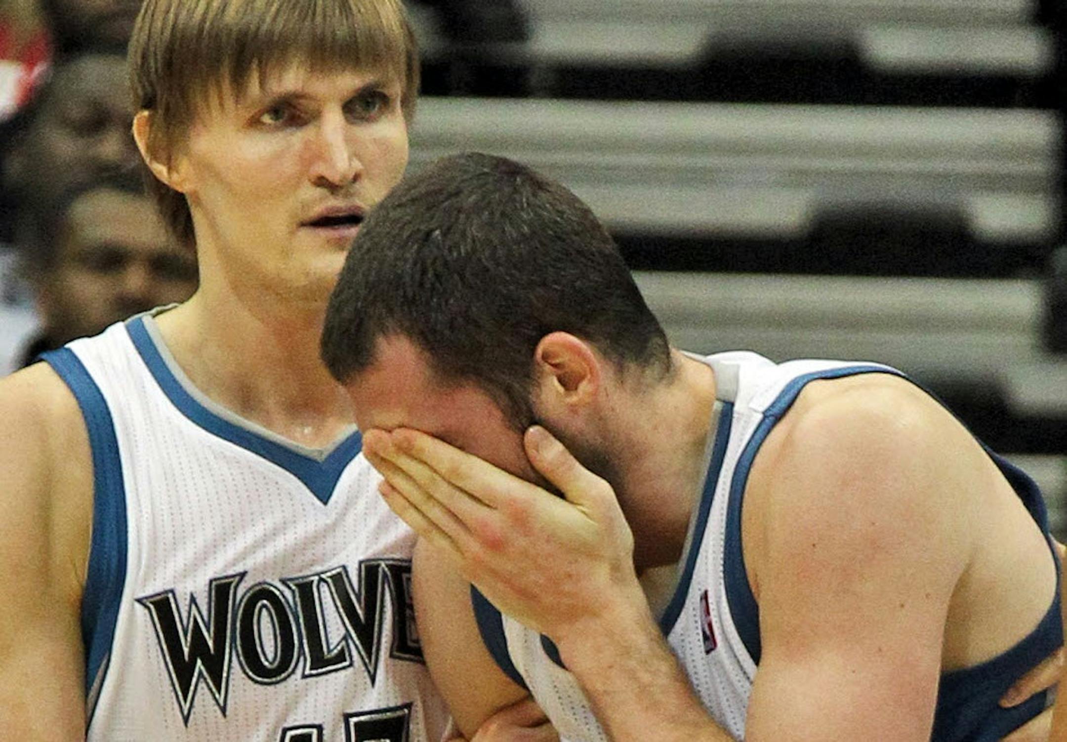 Andrei Kirilenko, left, came to the aid of teammate Kevin Love after Love was hit in the face.