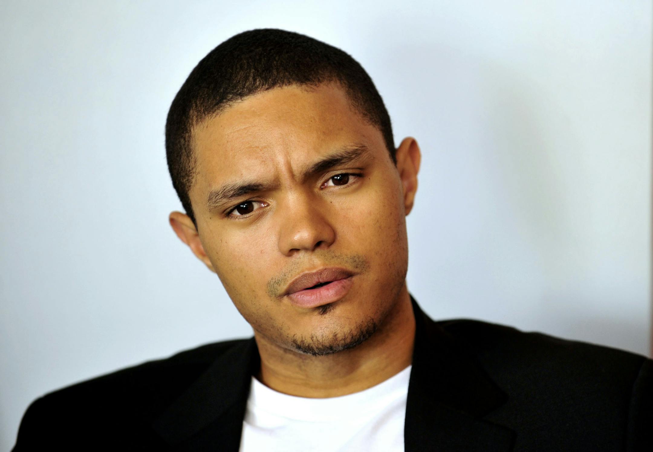 In this photo taken Oct. 27 2009 South African comedian Trevor Noah is photographed during an interview. Trevor Noah, a 31-year-old comedian from South Africa who has contributed to "The Daily Show" a handful of times during the past year, will become Jon Stewart's replacement as host, Comedy Central announced Monday March 30, 2015. Noah was chosen a little more than a month after Stewart unexpectedly announced he was leaving "The Daily Show" following 16 years as the show's principal voice. (AP