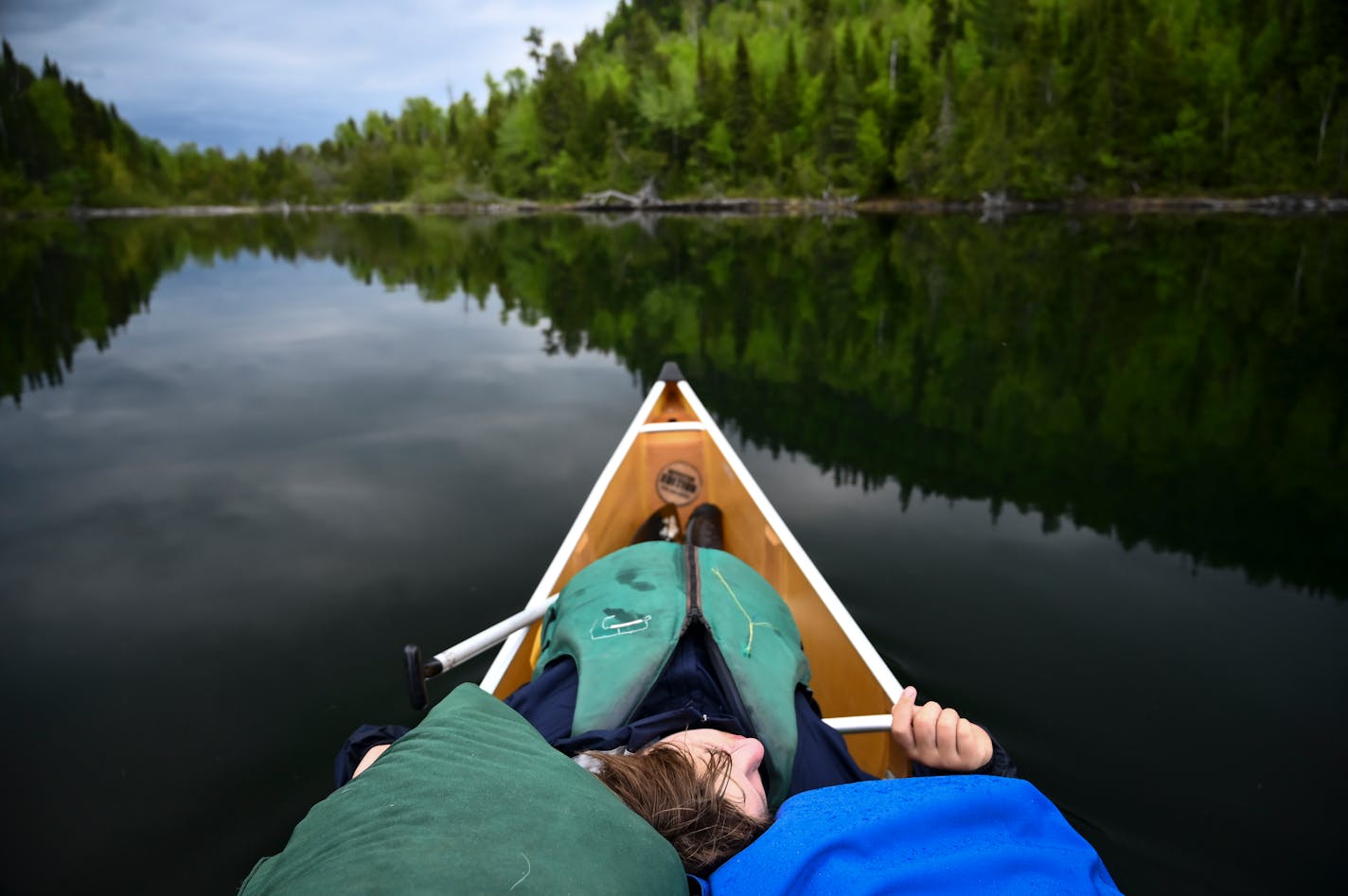 Aidan Jones took a quick rest before the portages from Mountain Lake into Moose Lake.