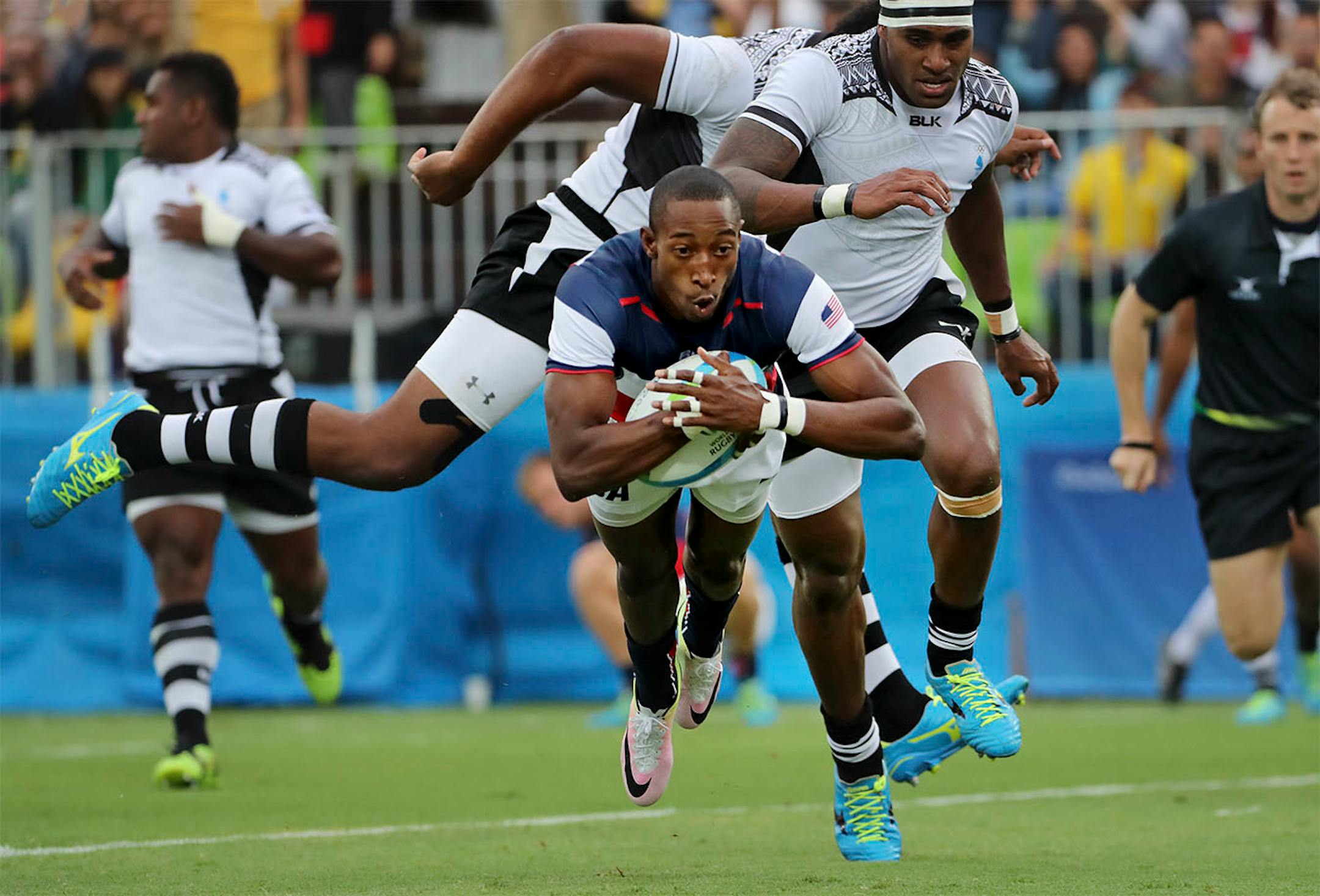 The United States men's rugby sevens team fell to Fiji 24-19 Wednesday afternoon at Deodoro Stadium to end preliminary play with a 1-2 record. Here, Perry Baker recaptured the lead on this try in the 2nd half.
