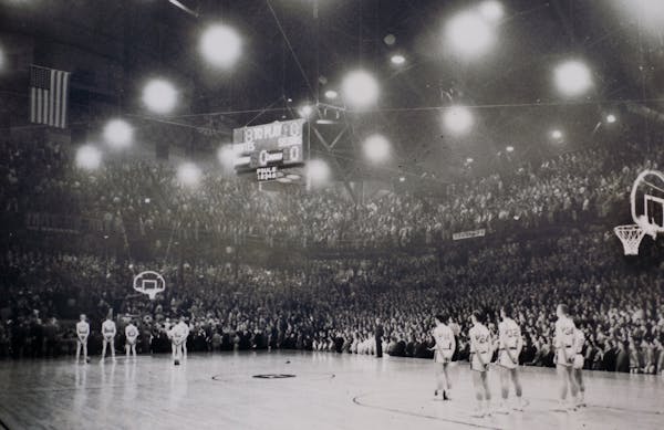 Standing for the national anthem just before the tip-off at Williams Arena for the 1960 boys' basketball final between Edgerton and Austin.