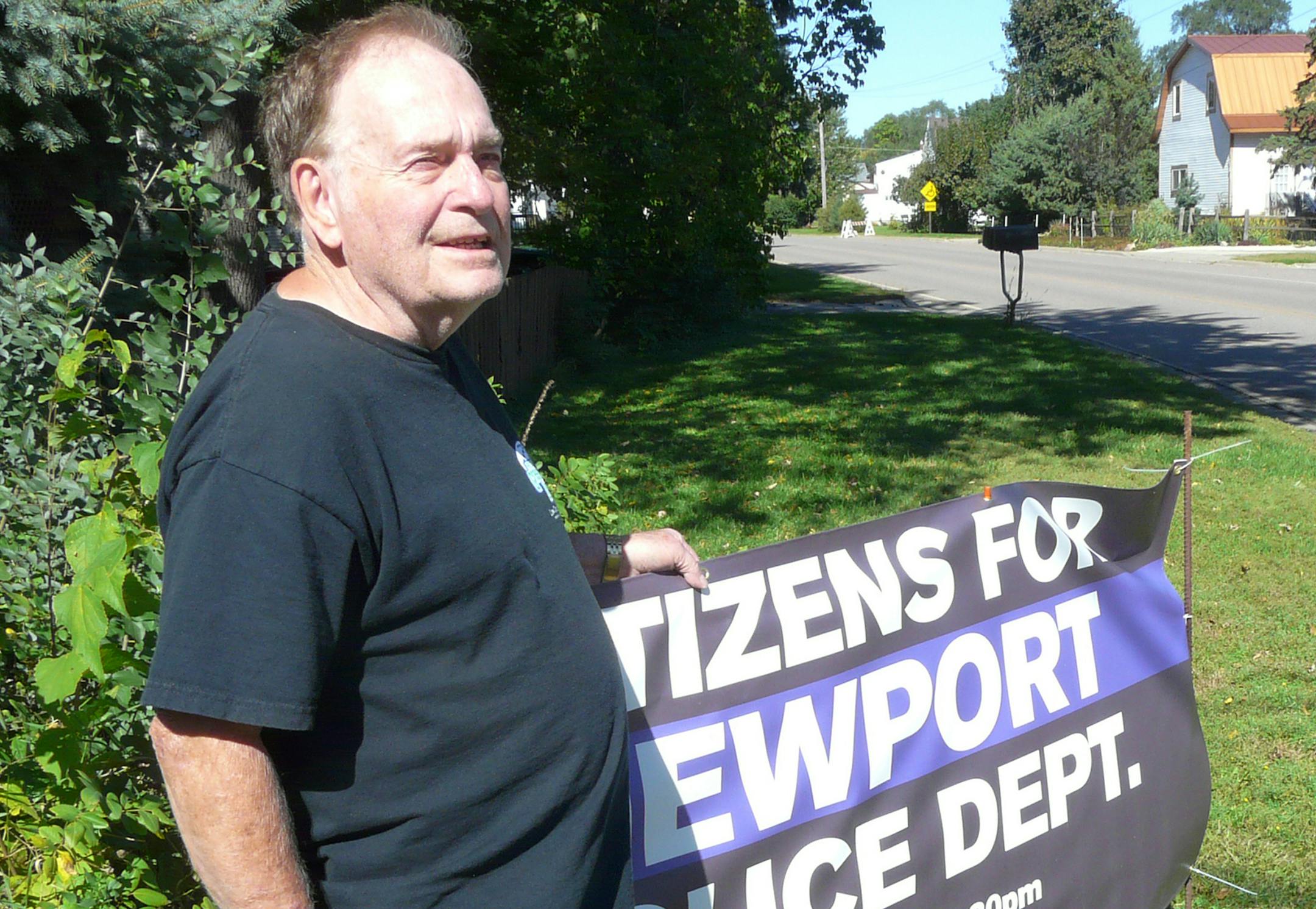 Fred Leimbek, a retired Newport police officer, has a sign in his yard facing City Hall, calling on residents to turn out for a council meeting in October that will consider abolishing the city’s police department.