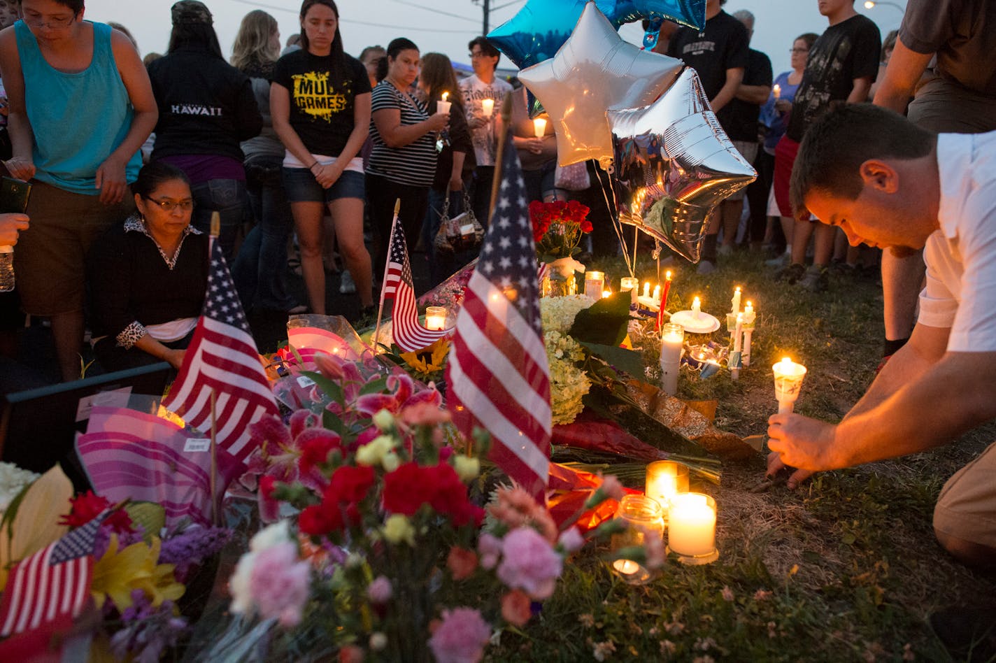 Members of the local community gathered at Dodd Rd. and Smith Av. in West St. Paul on Wednesday to honor Mendota Heights police officer Scott Patrick.