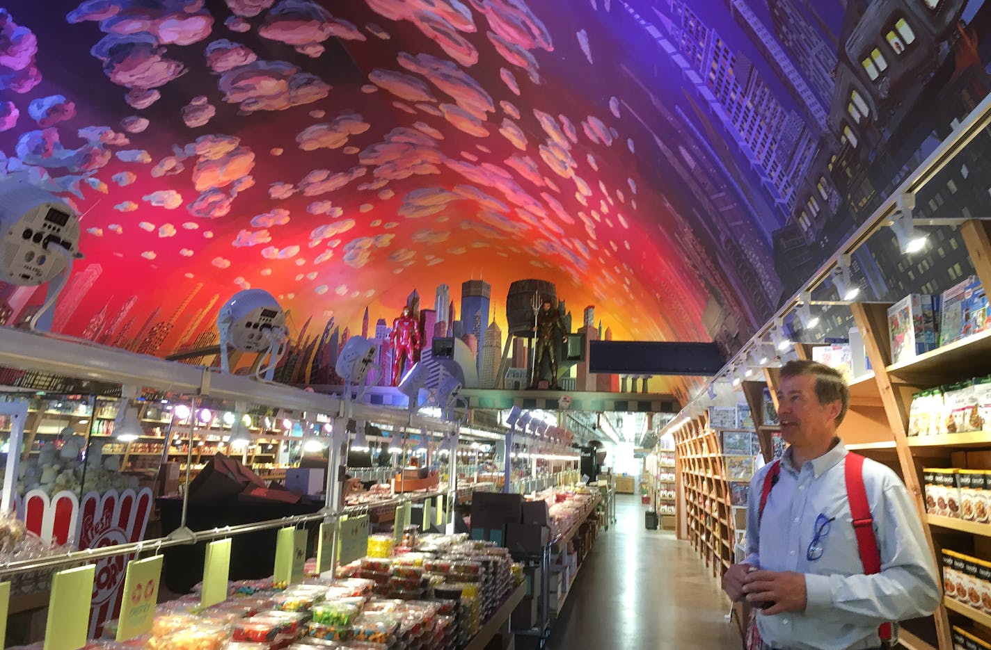 Robert Wagner, owner/operator of Minnesota's Largest Candy Store, commissioned 11 artists to create a ceiling mural of Gotham City and Minneapolis. Beloved superheroes like Batman, Spiderman and the Incredible Hulk loom throughout the $100,000 artwork.