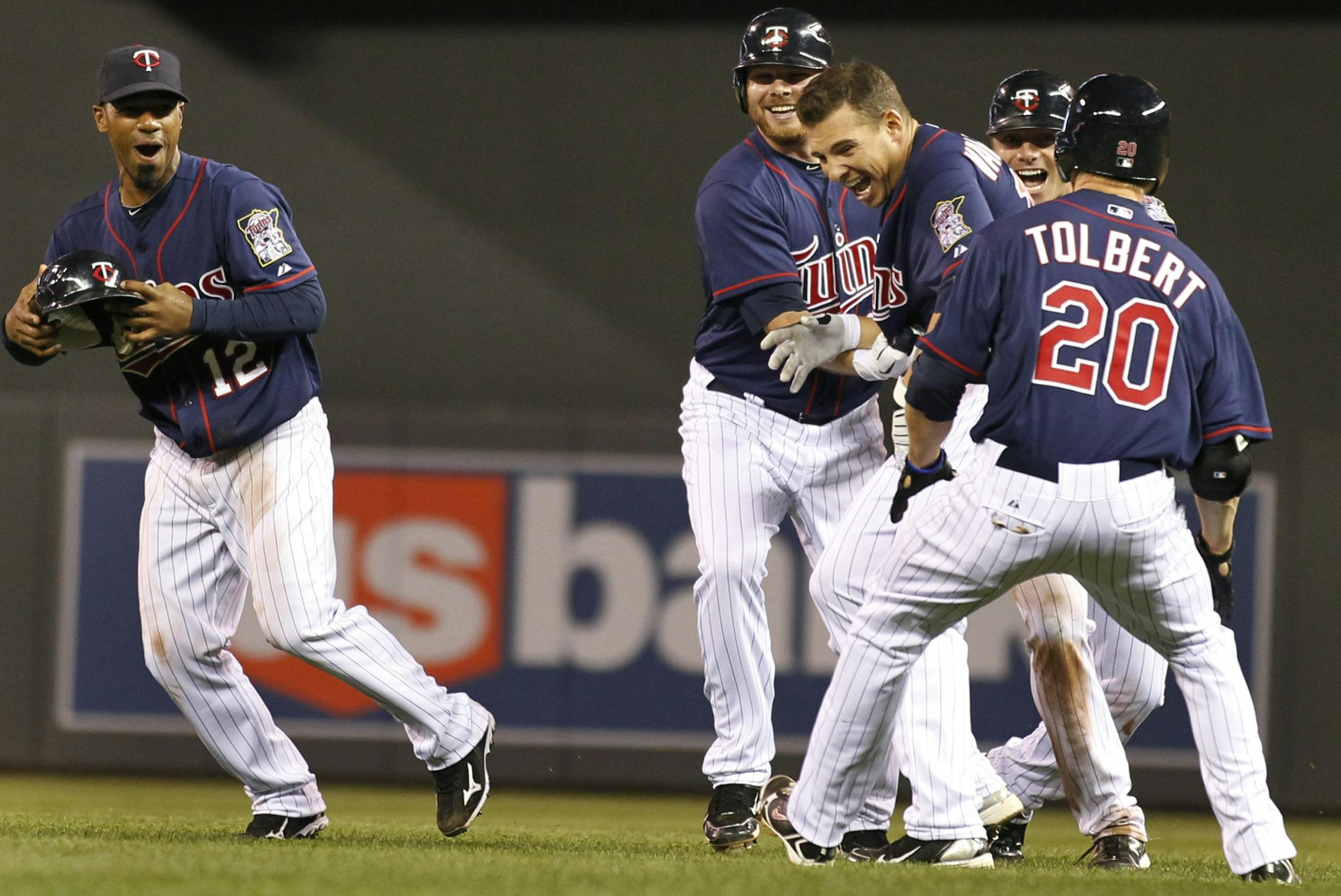 Danny Valencia (center ) celebrated with teammates (from left) Alexi Casilla, Jason Kubel, Luke Hughes, and Matt Tolbert after Valencia got the winning hit.