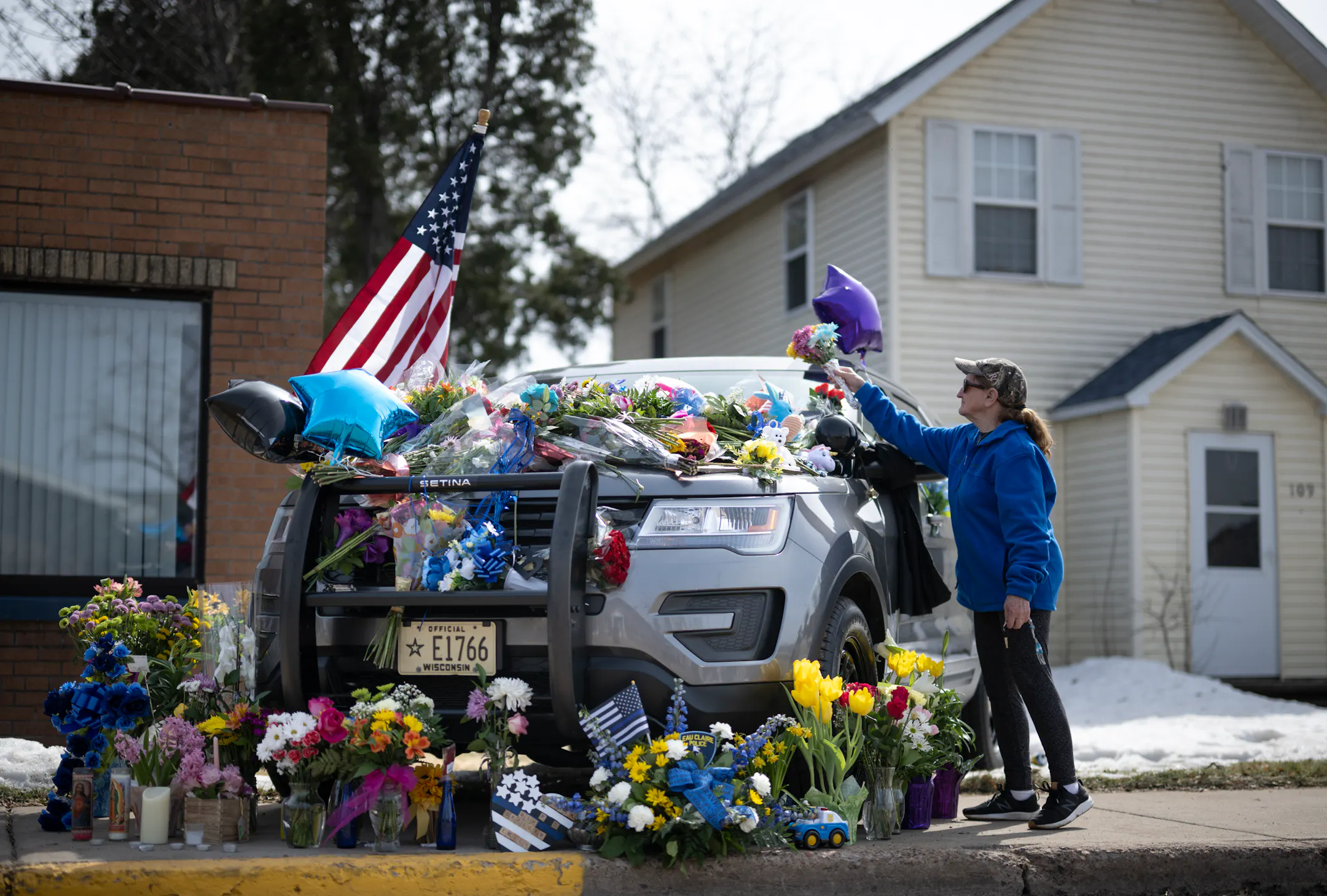 Western Wisconsin towns mourn 2 police officers shot over the weekend