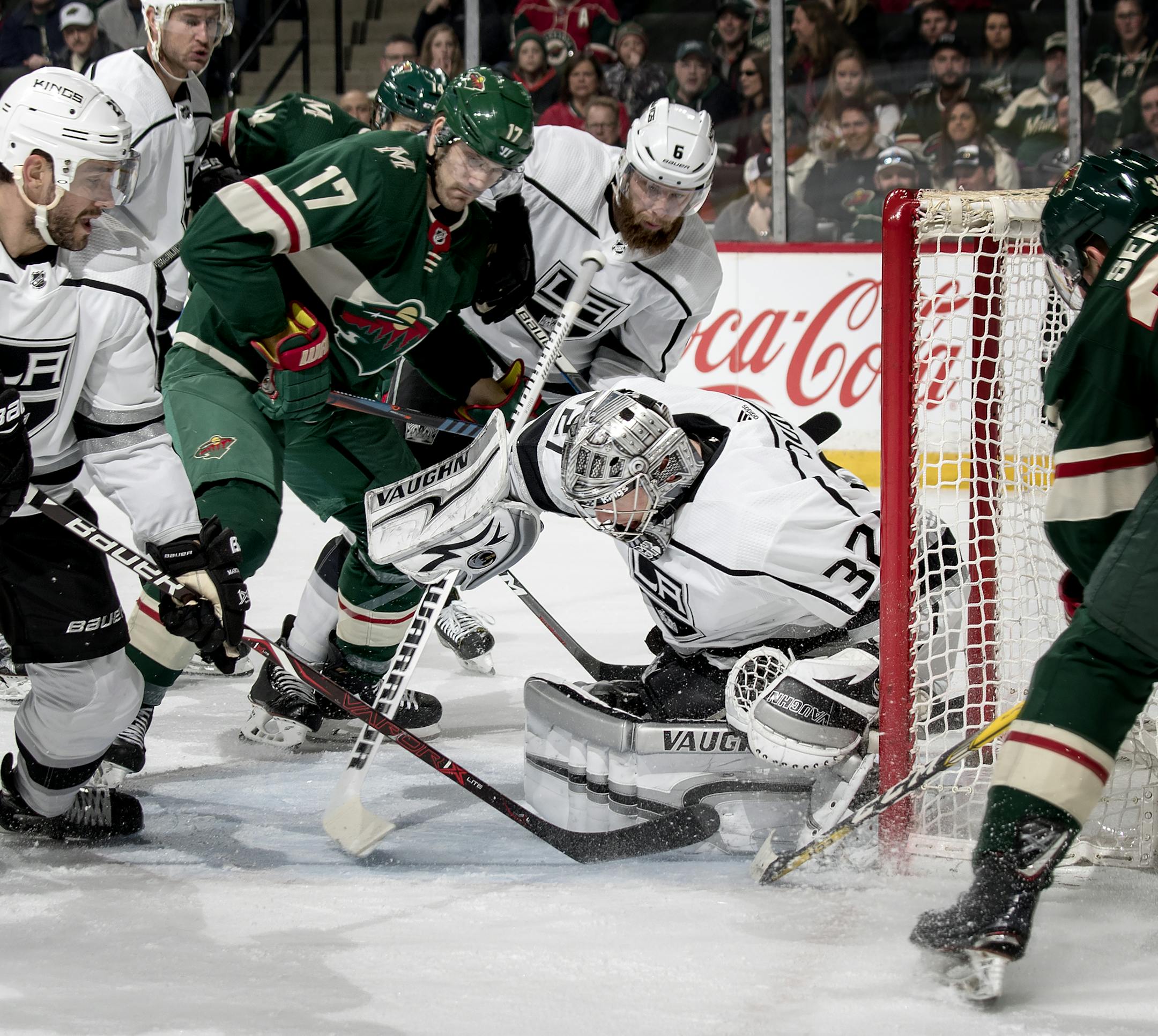 Wild winger Marcus Foligno applied pressure as Kings goalie Jonathan Quick blocked a shot in the first period Monday.