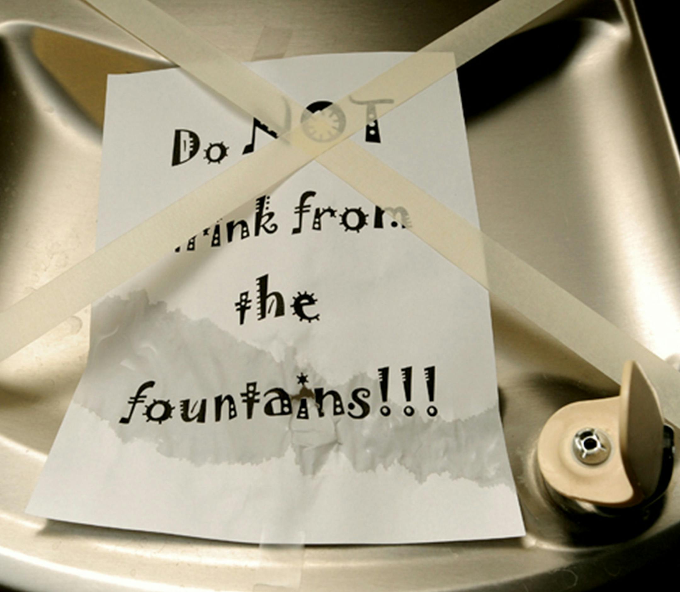 Water fountains at Glendive, Mont., schools are off limits after a Bridger Pipeline broke under the Yellowstone River, Wednesday, Jan. 21, 2015. Workers recovered about 10,000 gallons of oil from a ruptured pipeline that spilled crude into Yellowstone River and contaminated the drinking water supply of the eastern Montana city downstream. An estimated 40,000 gallons is still in the river and will be difficult to remove because of a thick layer of ice. (AP Photo/The Billings Gazette, Larry Mayer