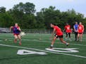 Rochester United FC players Lindsey Monnet (left) and Thainá Cavalcante during a recent team practice at Mayo High School in Rochester, Minn.