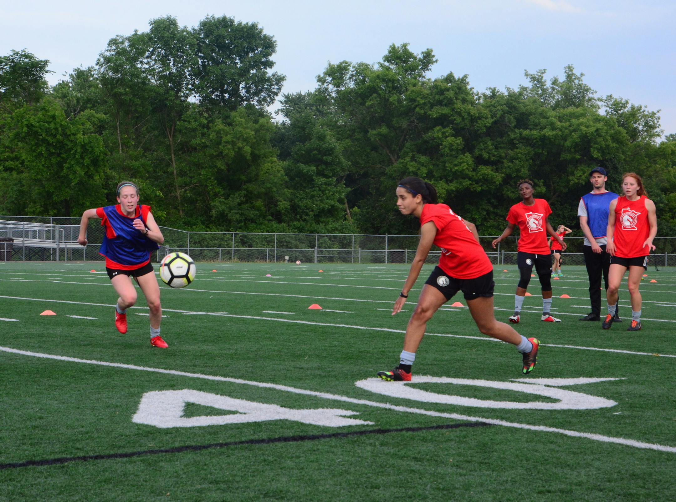 Rochester United FC players Lindsey Monnet (left) and Thainá Cavalcante during a recent team practice at Mayo High School in Rochester, Minn.