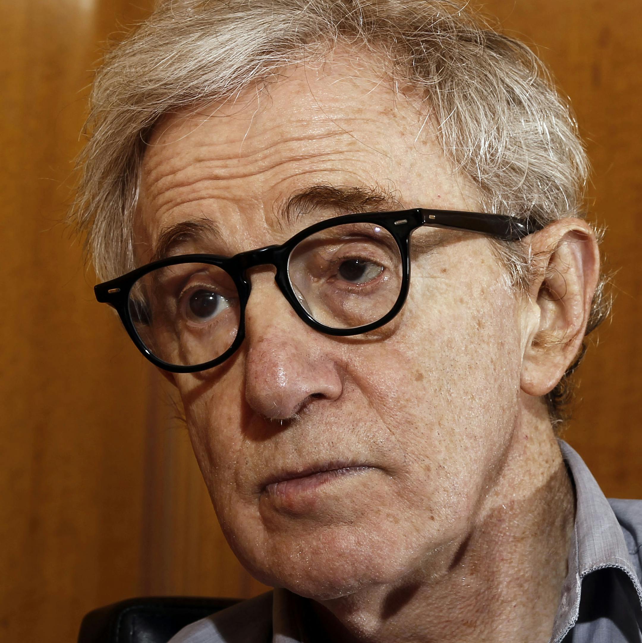 FILE - In this Dec. 29, 2011 file photo, Woody Allen, director of the film, "Midnight in Paris," is photographed during an interview in Beverly Hills, Calif. In nearly 45 years of alternating between toast of the town and yesterday‚Äôs news, Allen has barely deviated from a simple formula: make a movie a year on an economical budget and avoid the show business baubles that distract from his routine. (AP Photo/Matt Sayles) ORG XMIT: MIN2013070214261550