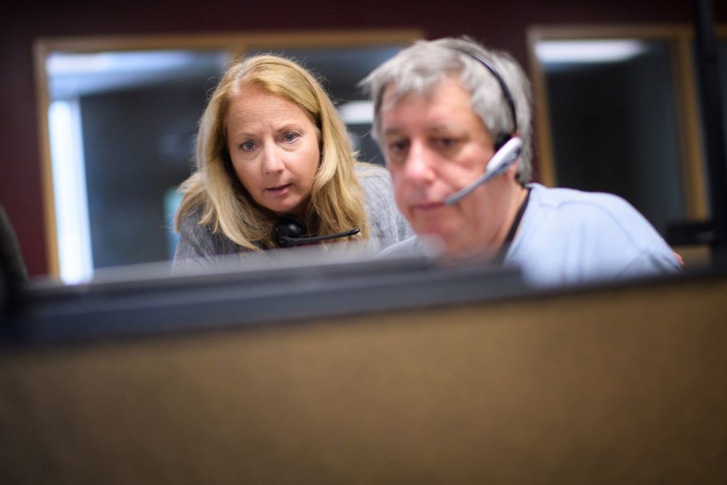 Crisis Connection manager and psychotherapist Laura Weber worked with a volunteer speaking to a caller who was in a mental health crisis. Crisis Connection call center in Richfield is being forced to close at the end of the week due to lack of funding.