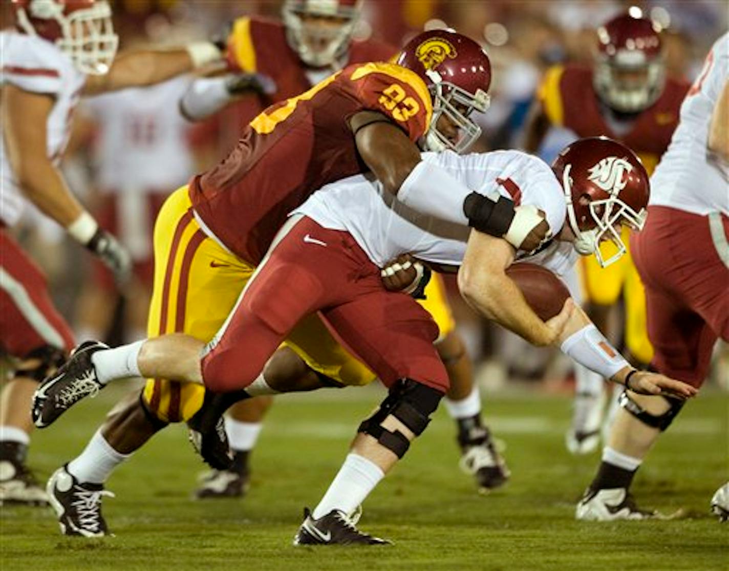 Southern California defensive end Everson Griffen sacks Washington State quarterback Marshall Lobbestael during the first half of an NCAA college football game in Los Angeles, Saturday, Sept. 26, 2009.  (AP Photo/Chris Carlson)